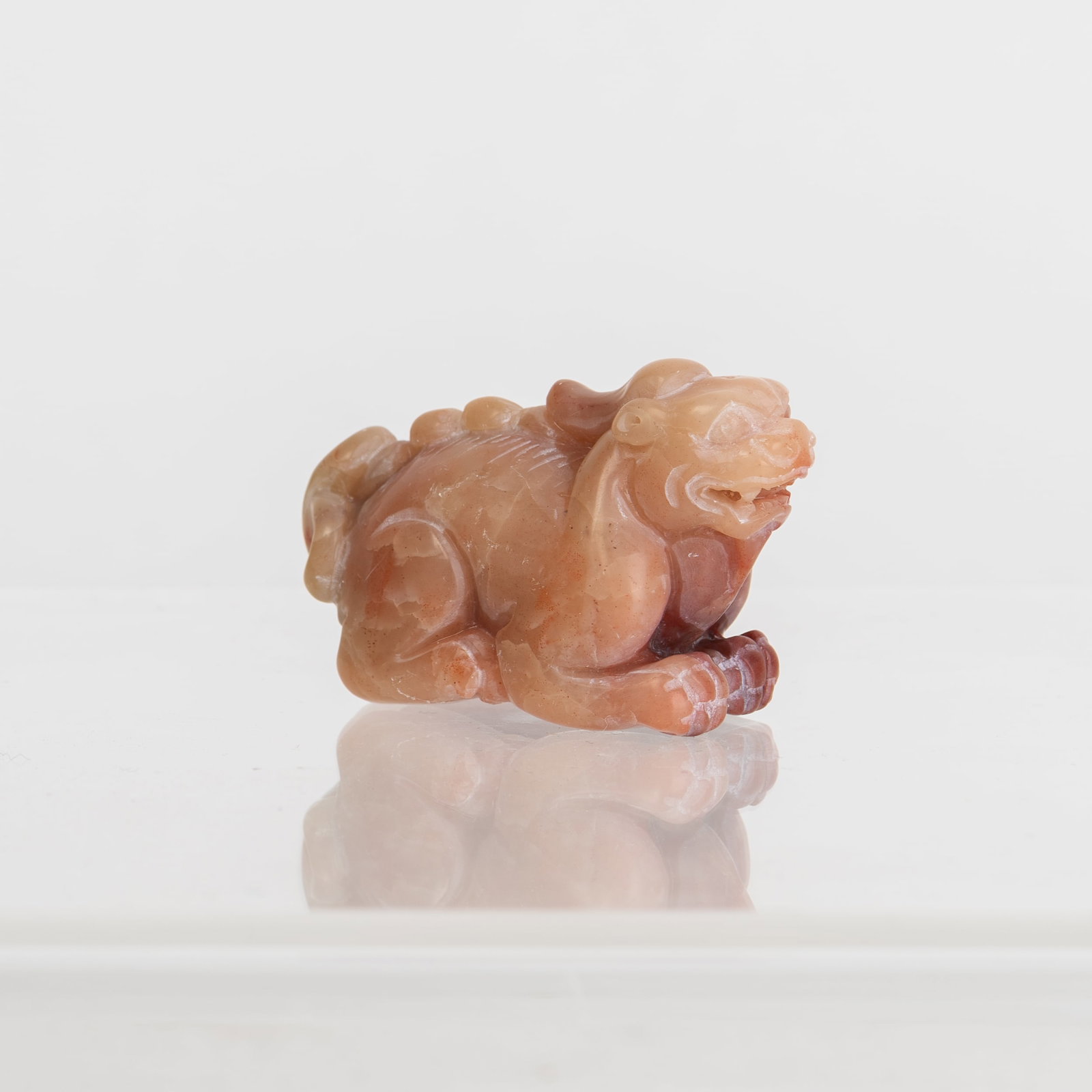 A SHOUSHAN LION-SHAPED STONE: A Shoushan lion-shaped stone. 1.25"h x 1"w x 2.25"l
