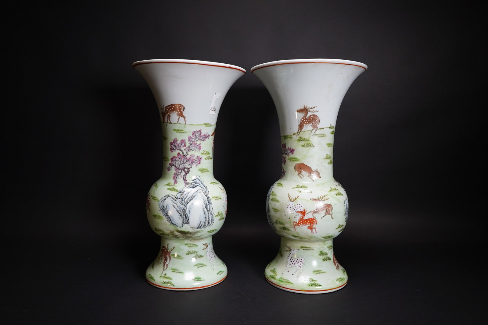 (LOT OF 2) PAIR OF CHINESE FAMILLE-VERTE 'DEER' VASES, QIANLONG MARK: (lot of 2) A pair of Chinese famille-verte porcelain vases decorated with deer on grass, each bearing a four-character 'Qianlong Nian Zhi' mark on the base.