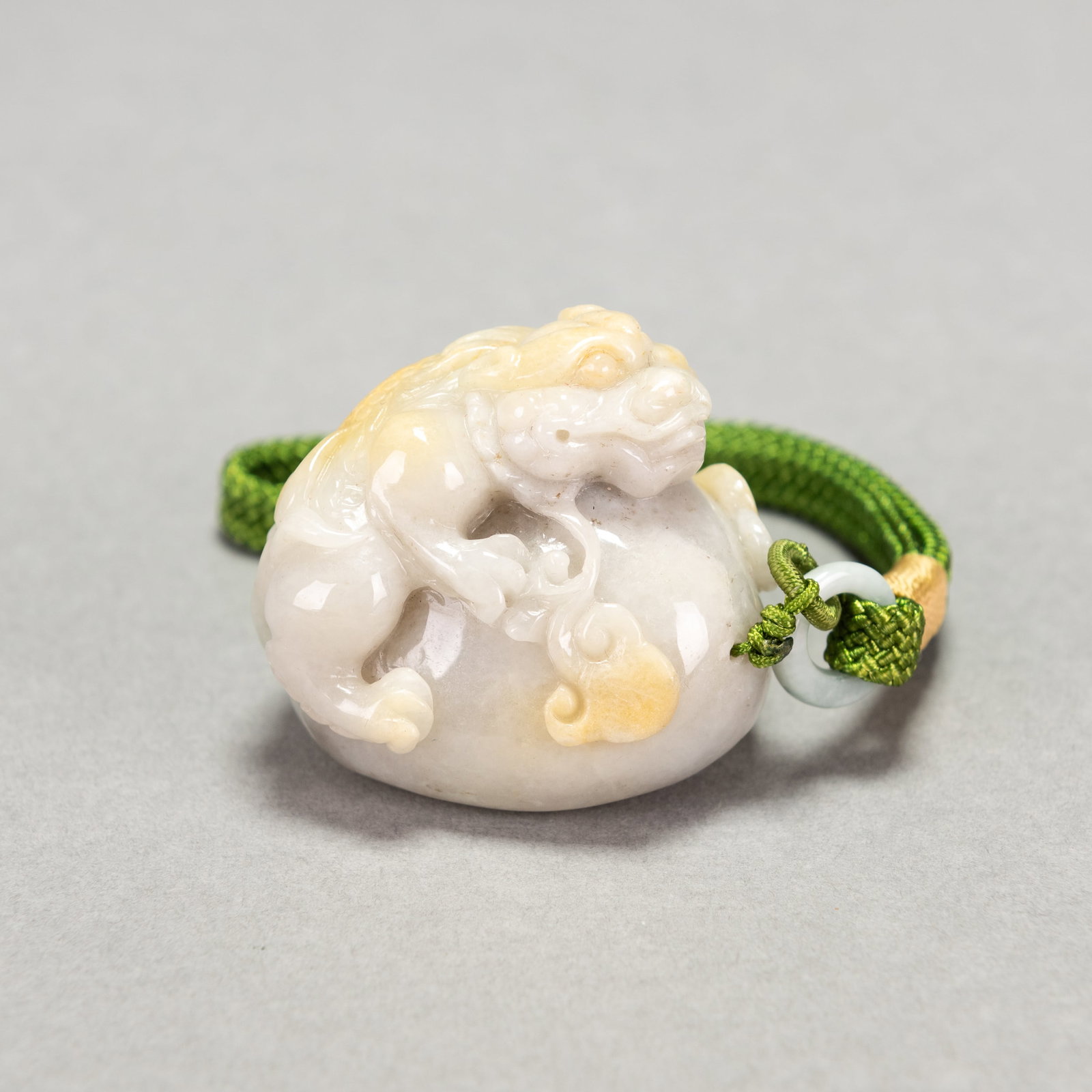 CARVED JADE QILIN PENDANT: Carved jade Qilin pendant. 1.77"h x 1.77"w x 1.97"l (4.5 x 4.5 x 5 cm); 118.2 dwt