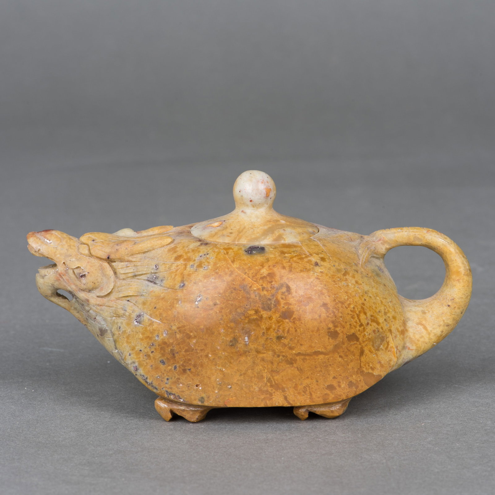 A SHOUSHAN SOAPSTONE 'DRAGON' TEAPOT: A Shoushan soapstone 'dragon' teapot. 2.56"h x 5.12"w x 2.36"d (6.5 x 13 x 6 cm)