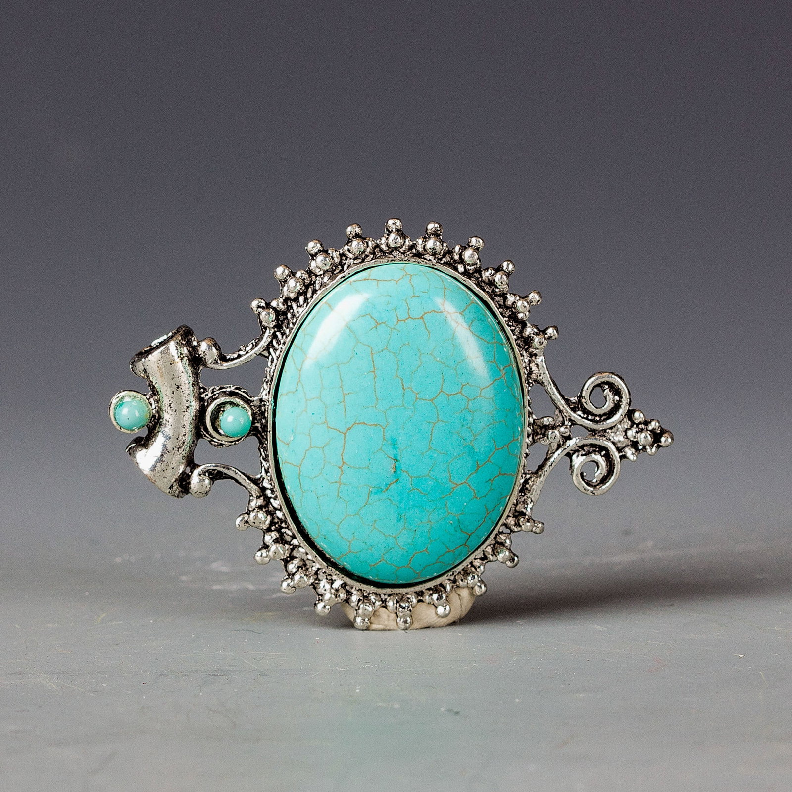 KALLAITE PENDANT: Kallaite pendant. A large light-blue kallaite stone is set on a white-colored metal base. 2.75"h x 2"w (6.99 x 5.08 cm)