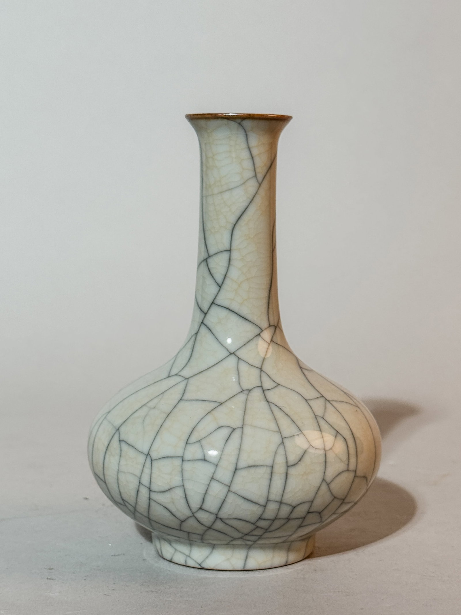 CHINESE GUAN CRACKLE GLAZED PORCELAIN VASE WITH MING MARK: A Chinese Guan crackle glazed porcelain vase with Ming mark. Dimensions: Height: 5.5 in. (14.0 cm). Note: This item is in New York, where it can be shipped from.