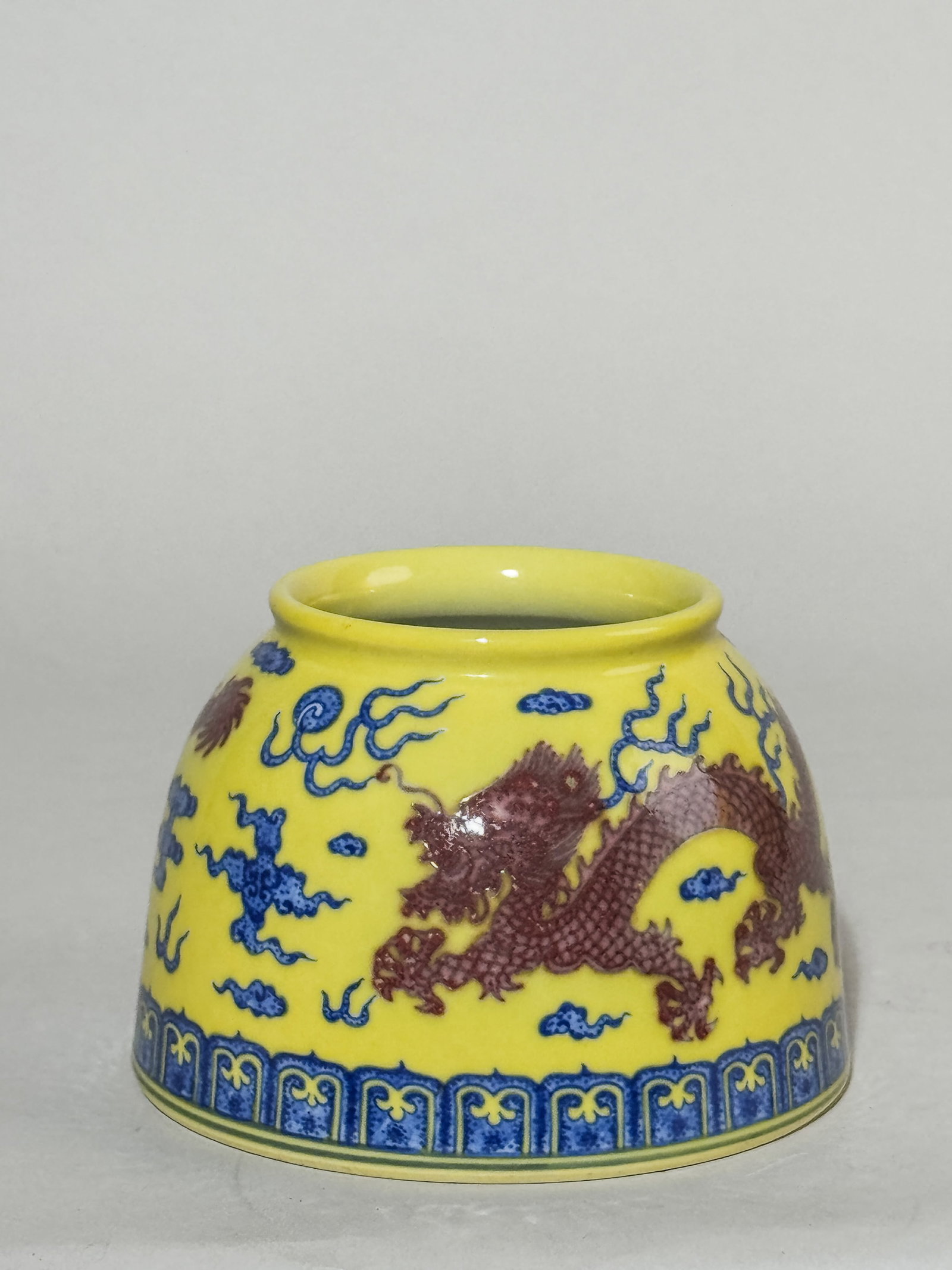 CHINESE YELLOW PORCELAIN BRUSH WASHER WITH DRAGON: A Chinese yellow-ground porcelain brush washer with dragon. Dimensions: Diameter: 4.5 in. (11.4 cm); Height: 3 in. (7.6 cm). Note: This item is in New York, where it can be shipped from.