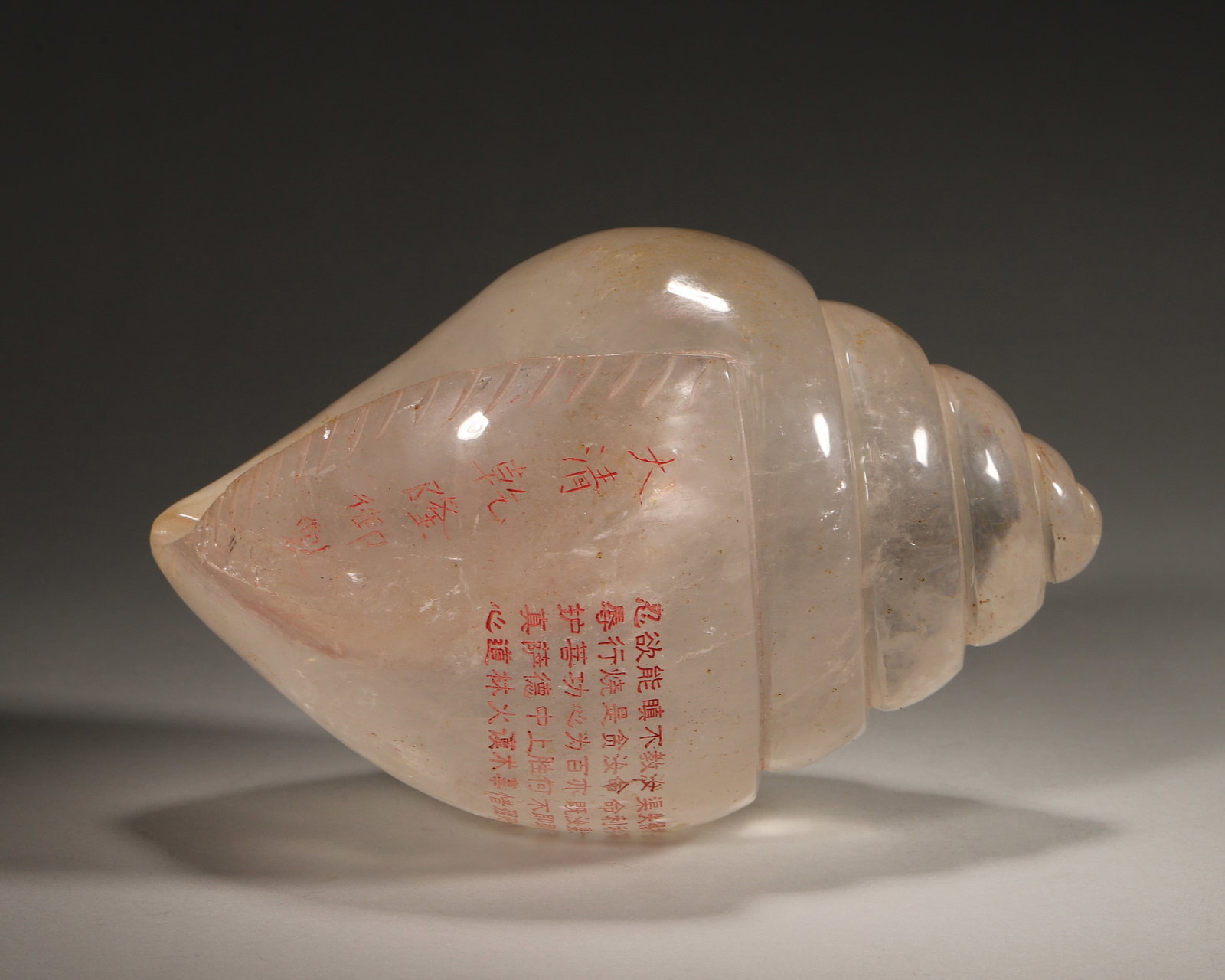 A CRYSTAL CONCH-FORM ORNAMENT: A crystal ornament in the form of a conch shell. L. 20 cm; Wt. 2,607 g.
