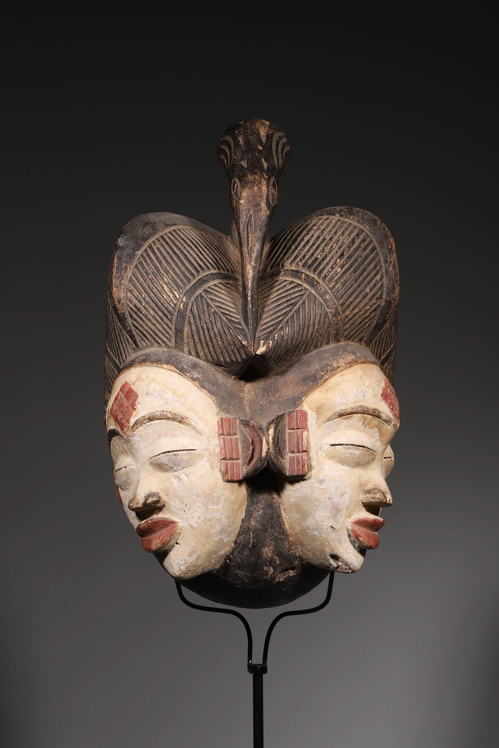 A PUNU CARVED WOOD DOUBLE-FACE MASK (1 of 8)