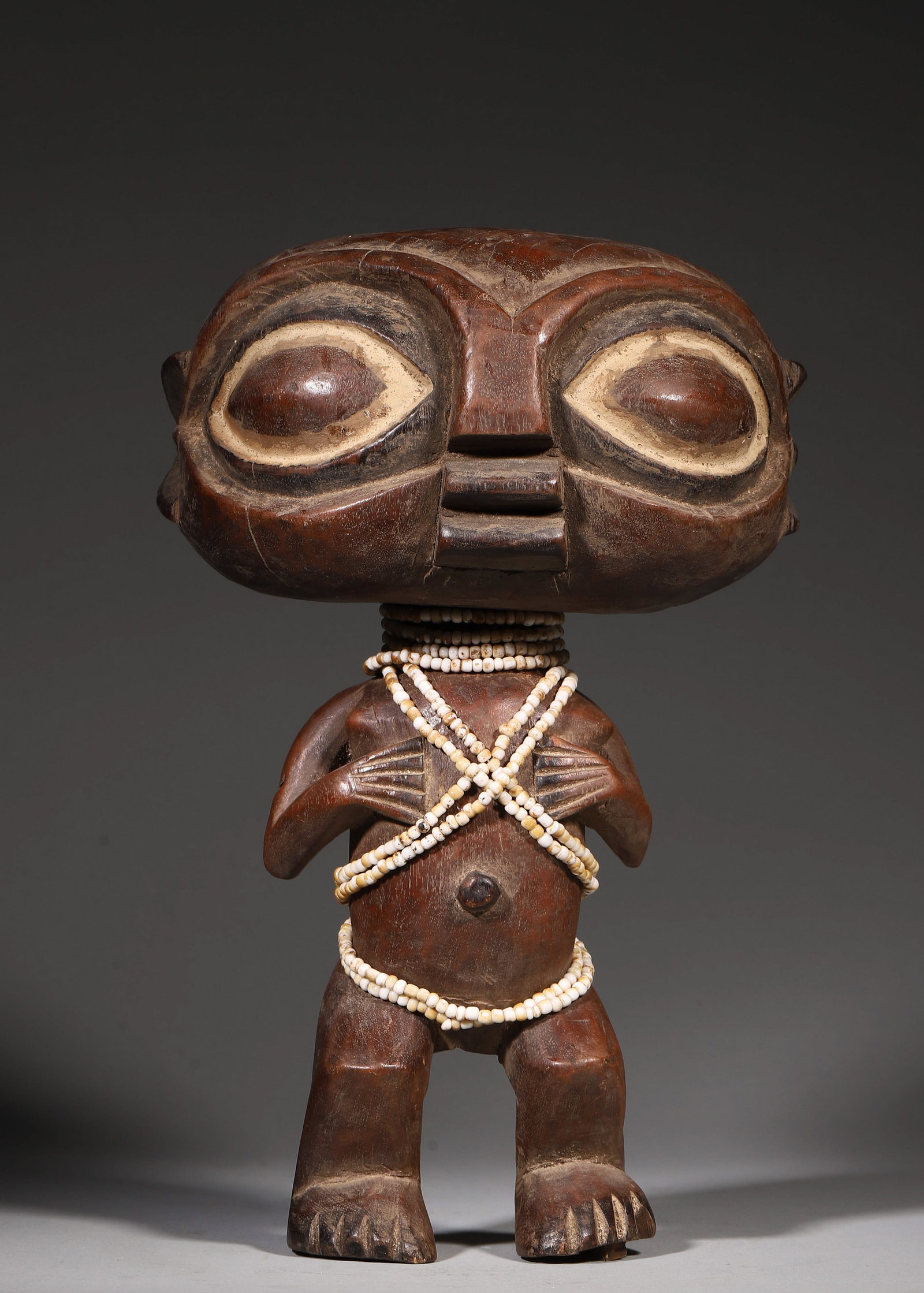 A CENTRAL AFRICAN CARVED WOOD FIGURE (1 of 8)