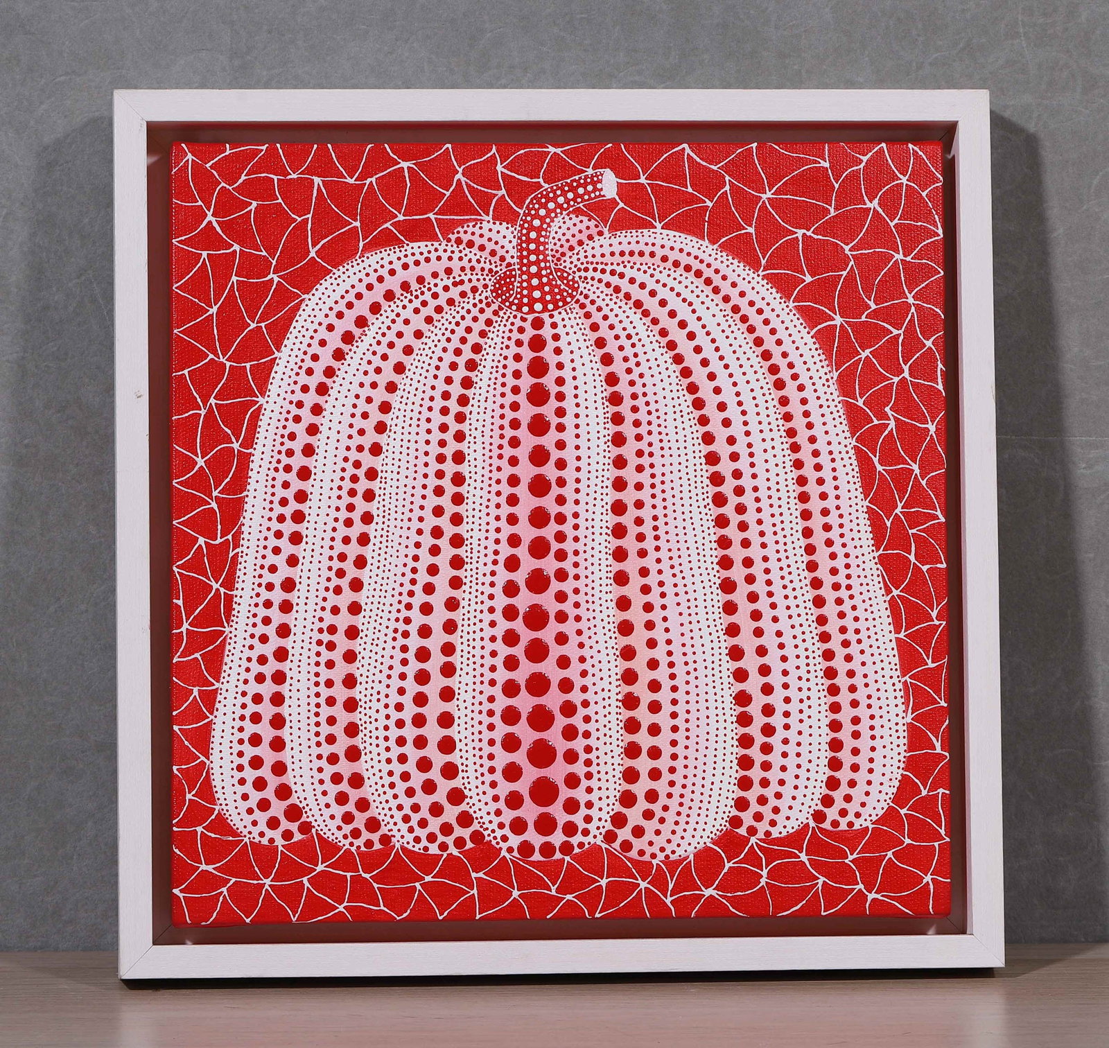 YAYOI KUSAMA, ATTRIBUTED TO, PUMPKIN, ACRYLIC ON CANVAS: Attributed to Yayoi Kusama. Acrylic on canvas depicting a white pumpkin with pink and red dots against a red ground with white net-like patterning, framed. Dimensions: 34 x 30 cm. Note: Yayoi Kusama