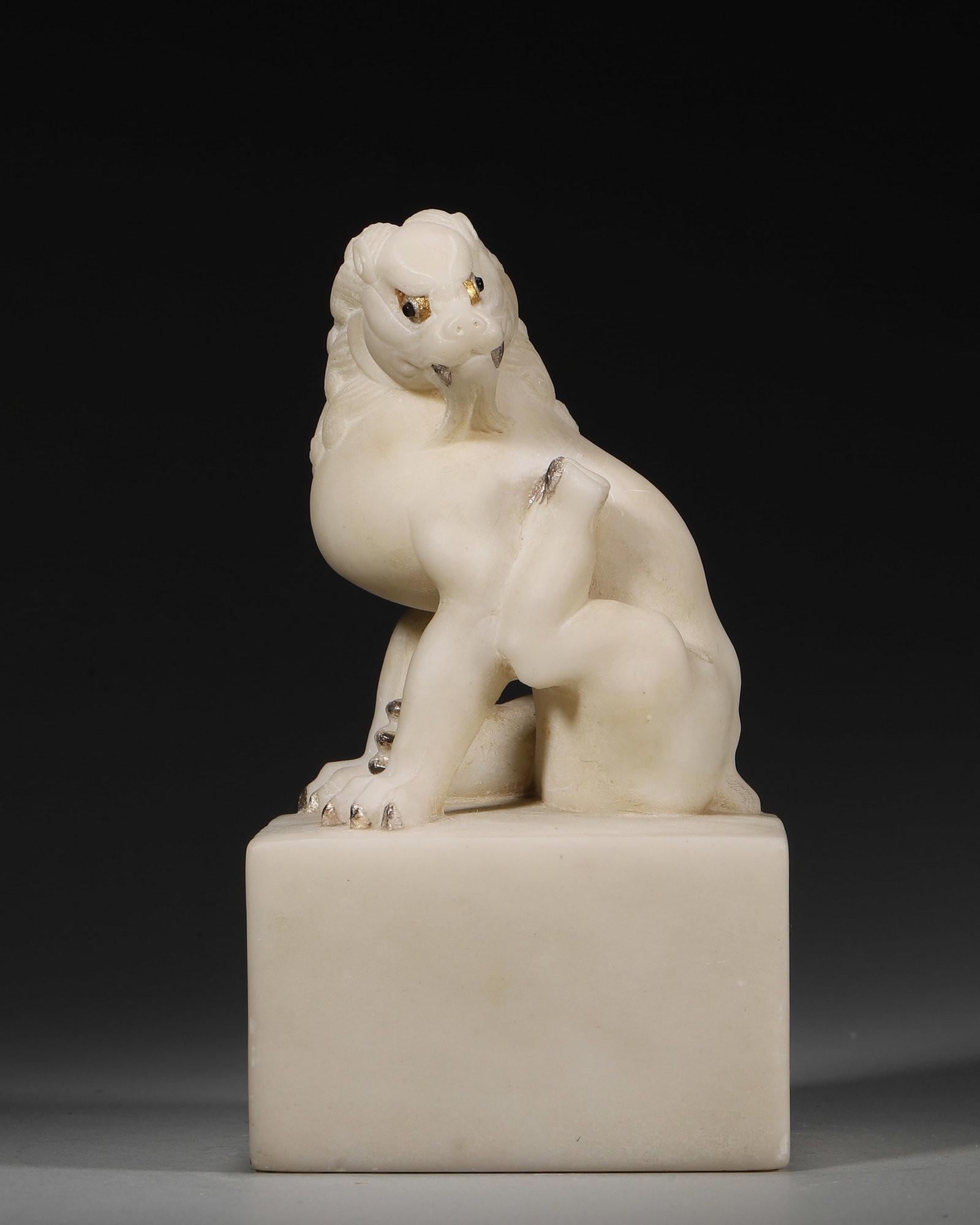A WHITE JADE BEAST-FORM PAPERWEIGHT: A white jade paperweight carved in the form of a beast. L. 8 cm; W. 8 cm; Ht. 14.5 cm; Wt. 1,161 g.