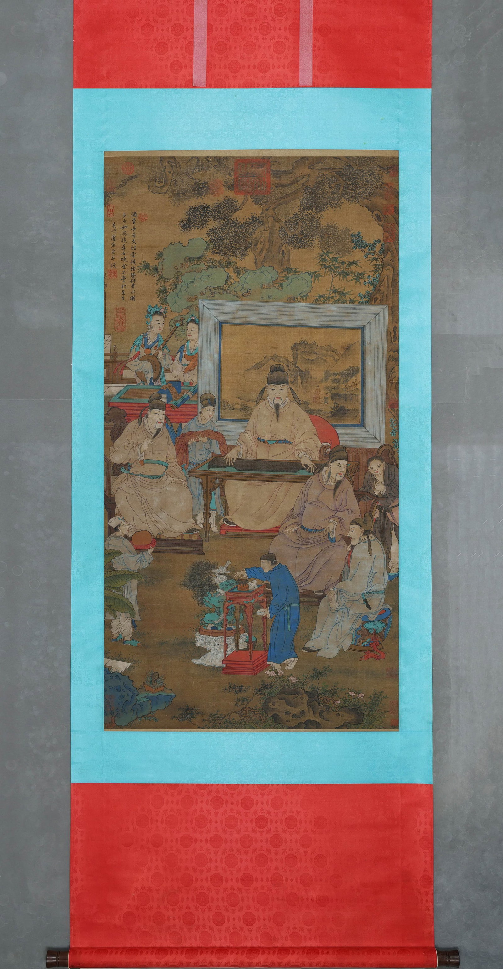 TANG YIN, ATTRIBUTED TO, GATHERING OF SCHOLARS, HANGING SCROLL: Attributed to Tang Yin. Ink and color on silk, hanging scroll, depicting scholars gathered around a table with a qin performance, attendants and female musicians in a garden setting. The work bears a