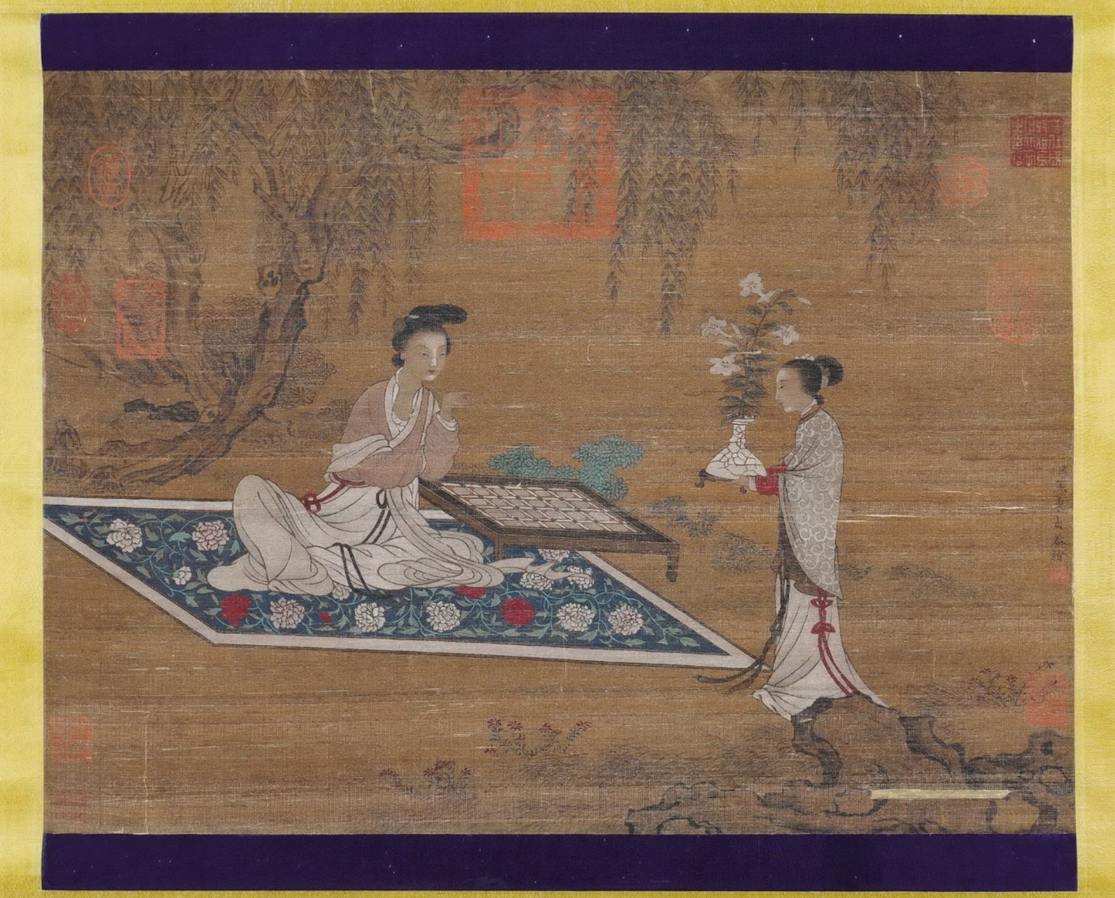 JIAO BINGZHEN, ATTRIBUTED TO, LADIES PLAYING GO UNDER WILLOWS, ALBUM LEAF: Attributed to Jiao Bingzhen. Ink and color on silk, album leaf, depicting ladies in a garden beneath willows, with a go board and a maid carrying lilies. The work bears a signature reading 'Your serva