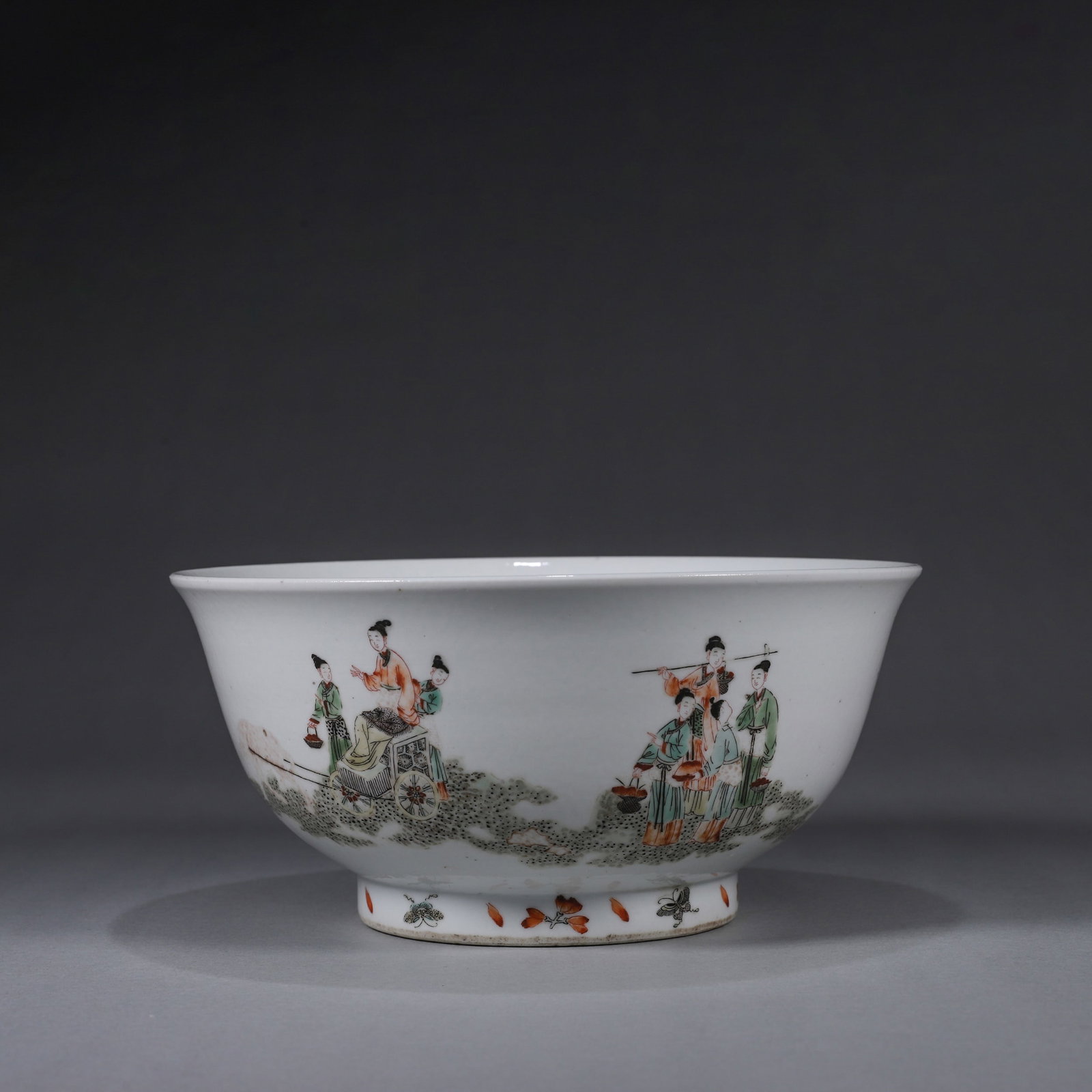 A WUCAI 'QUEEN MOTHER OF THE WEST' BOWL: A large wucai porcelain bowl decorated to the exterior with a procession scene of the Queen Mother of the West and to the interior with a peach motif. W. 19.5 cm; Ht. 8.3 cm.