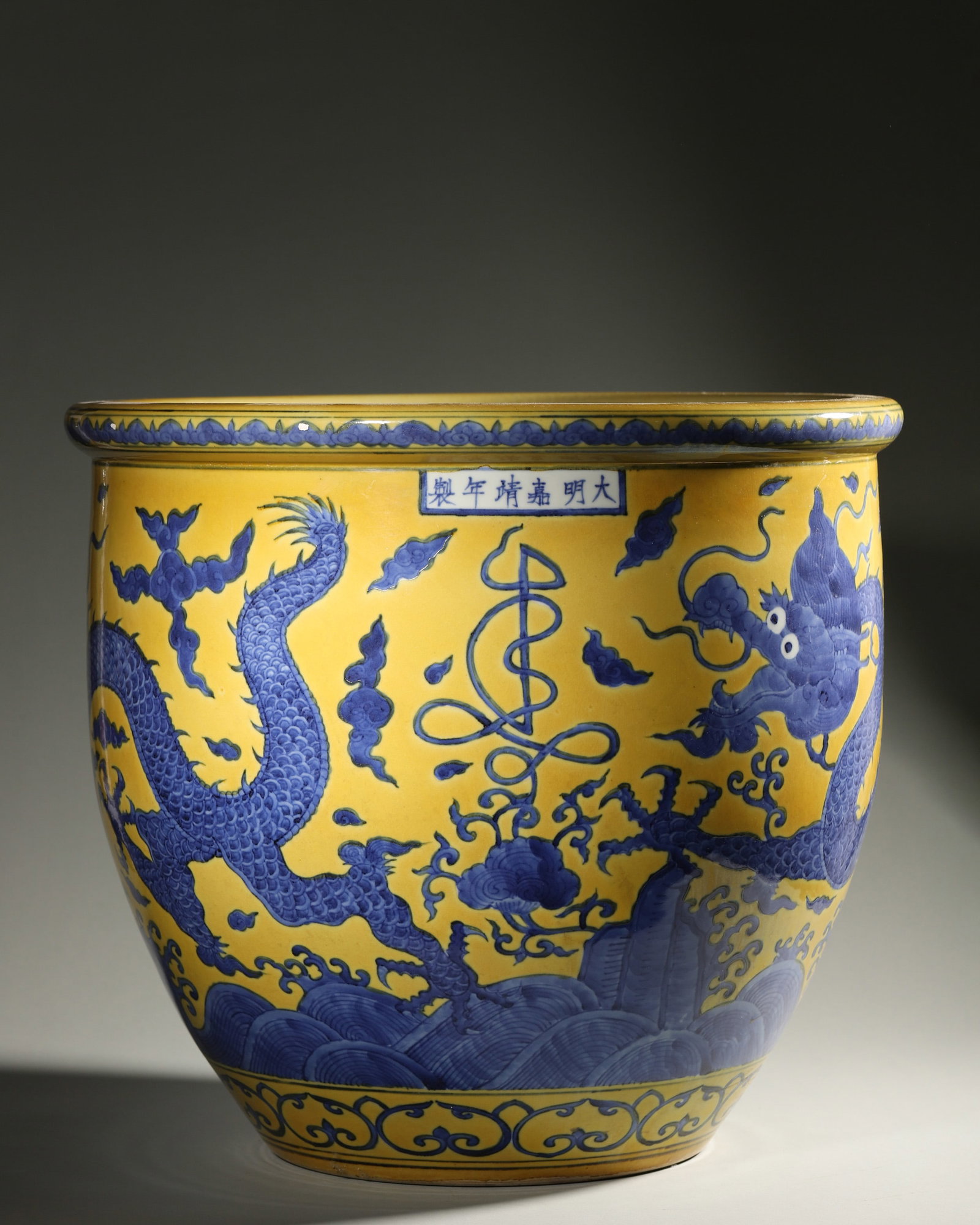 A YELLOW-GROUND BLUE-AND-WHITE 'DRAGON AND WAVE' JARDINIERE (1 of 8)