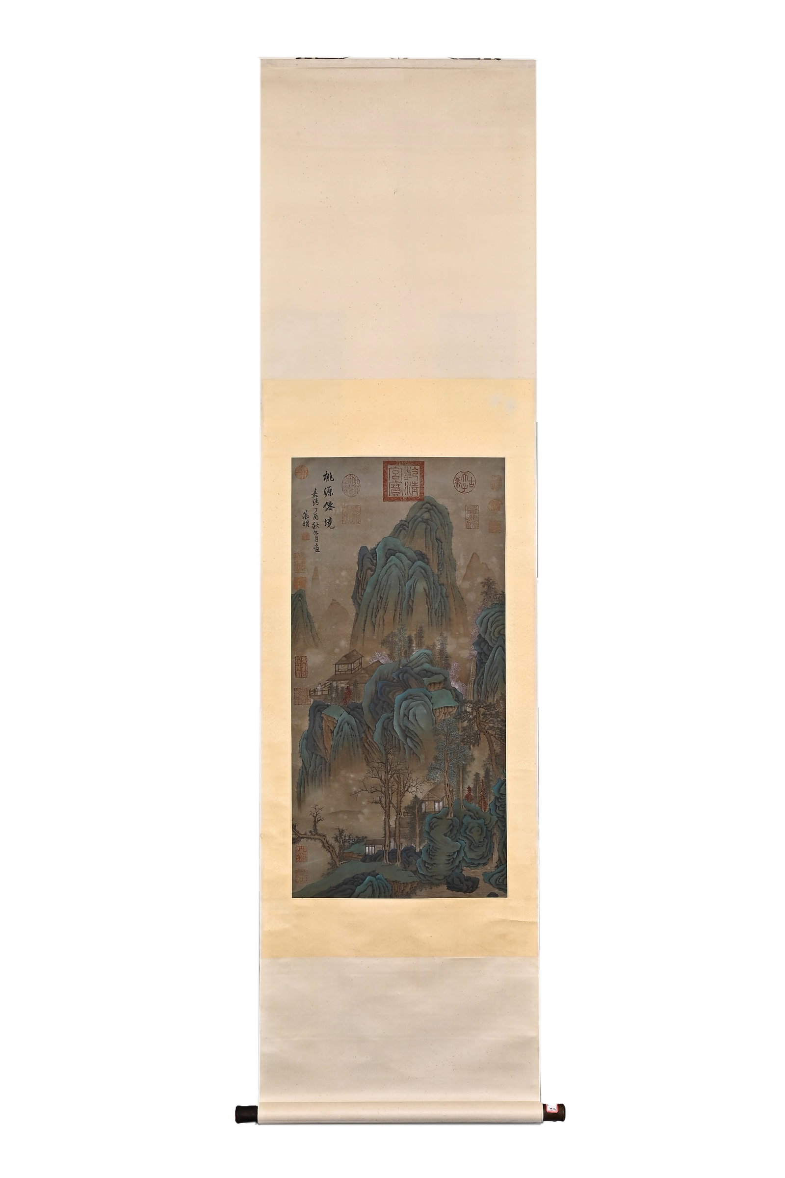 WEN ZHENGMING, ATTRIBUTED TO, PEACH BLOSSOM FAIRYLAND, HANGING SCROLL: Attributed to Wen Zhengming. A blue-and-green landscape in ink and color on silk, hanging scroll, depicting layered mountains and secluded dwellings. The work bears inscriptions and multiple seals. Di