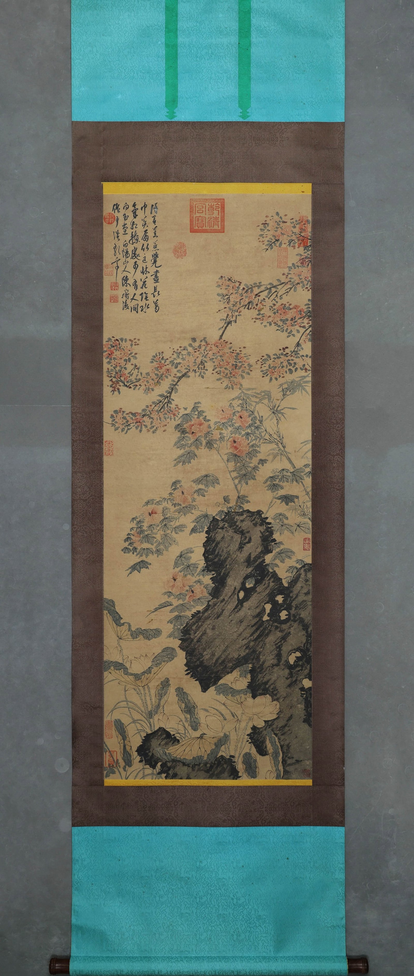 CHEN CHUN, ATTRIBUTED TO, FLOWERS AND GARDEN ROCK, HANGING SCROLL: Attributed to Chen Chun. Ink and color on paper, hanging scroll, depicting a garden rock with lotus, hibiscus, crab apple and bamboo. The work bears an inscription and multiple collector seals. Dimens