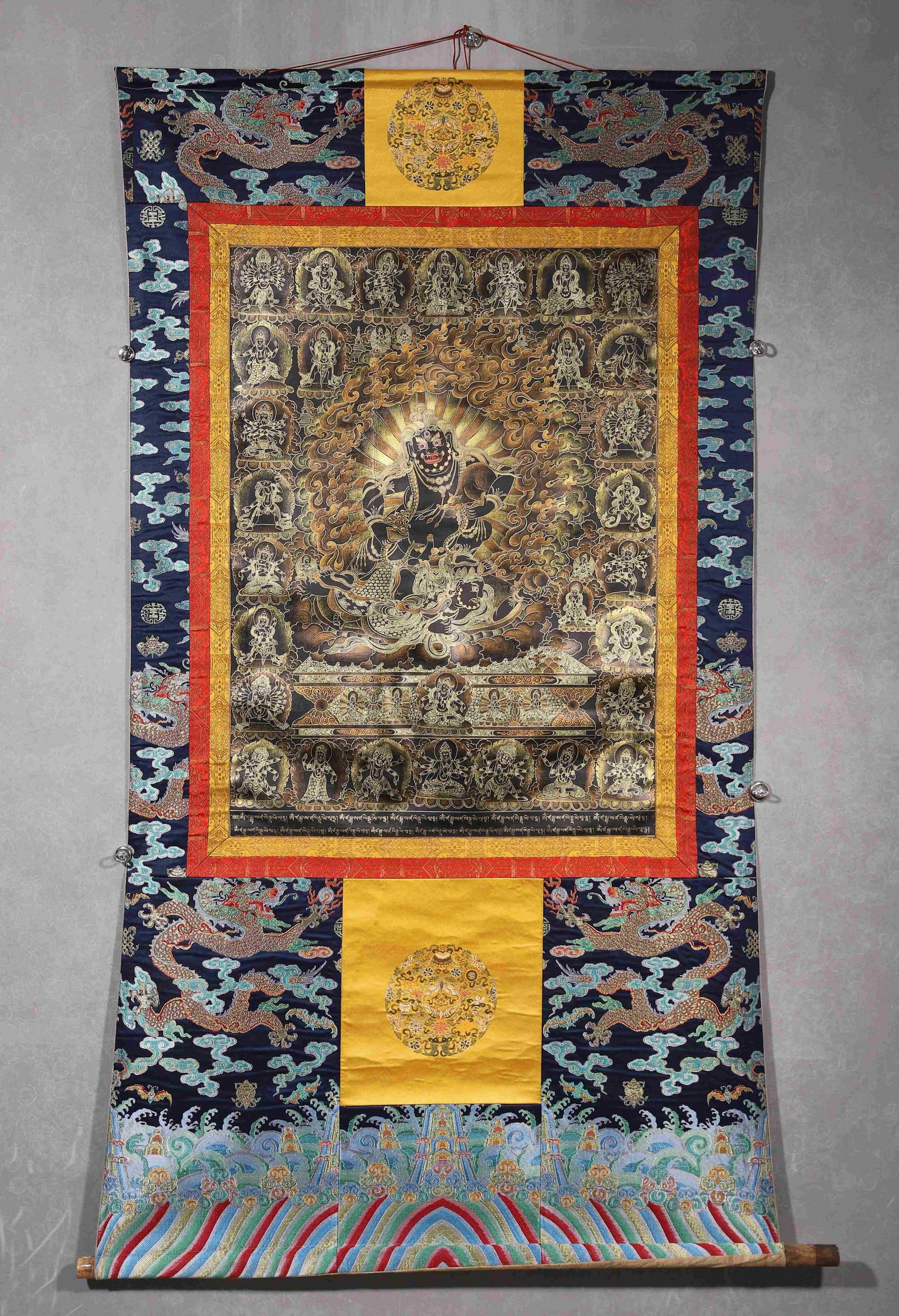 A BLACK-GROUND THANGKA OF MAHAKALA (1 of 12)