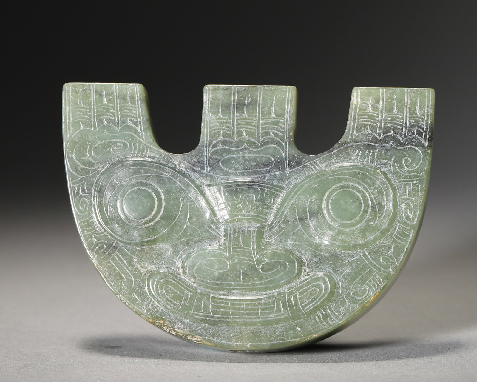 A JADE THREE-PRONGED ORNAMENT, LIANGZHU CULTURE (1 of 6)