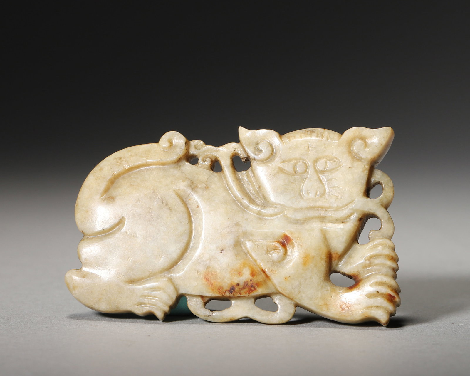 A JADE TIGER-FORM PENDANT (1 of 6)