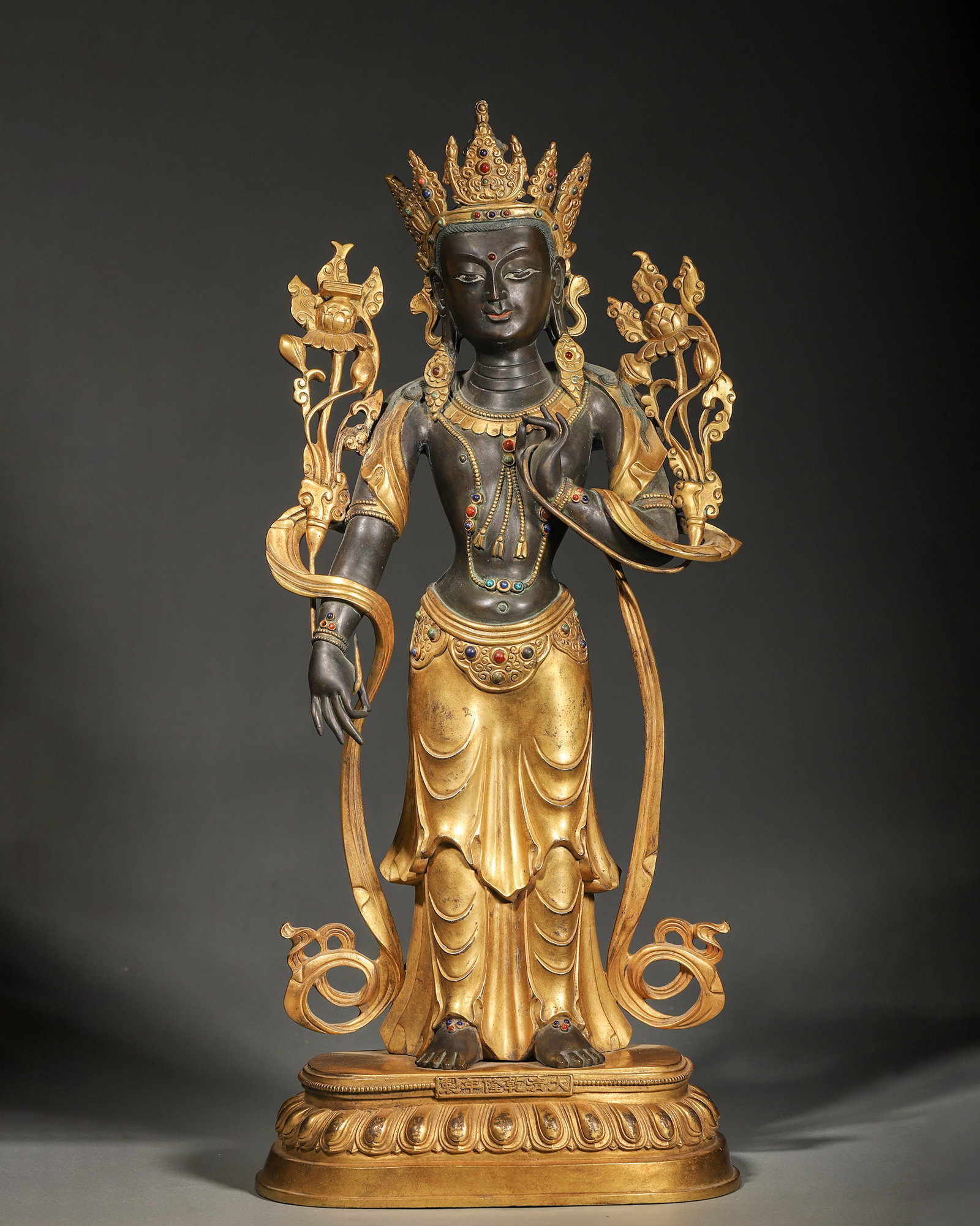 A GILT-BRONZE FIGURE OF PADMAPANI: A gilt-bronze standing figure of Padmapani. L. 24 cm; Ht. 59 cm; Wt. 12,100 g.
