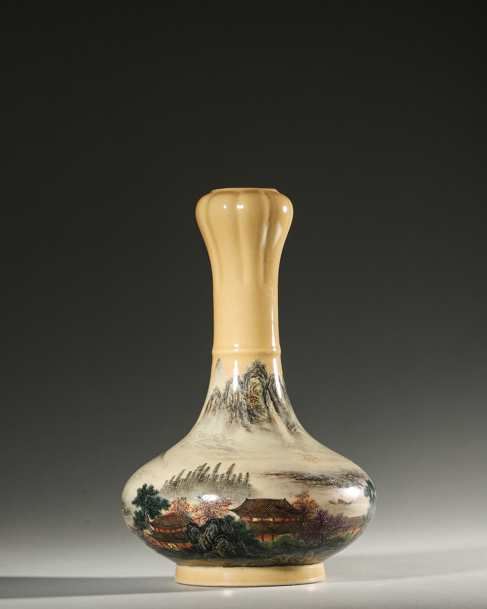 A YELLOW-GROUND POLYCHROME LANDSCAPE PORCELAIN VASE: A porcelain vase with polychrome landscape decoration on a yellow ground. Diam. 14 cm; Ht. 21 cm.