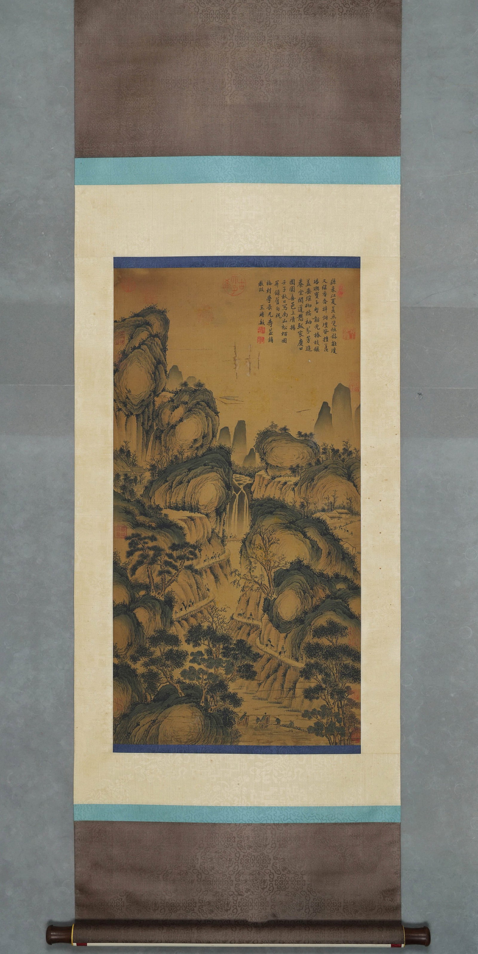 WANG SHIMIN, ATTRIBUTED TO, PINE AND CYPRESS LANDSCAPE, HANGING SCROLL: Attributed to Wang Shimin. Ink and color on silk, hanging scroll, depicting layered mountains, waterfalls, pines, cypresses and traveling figures. The work bears an inscription and multiple seals. Dim
