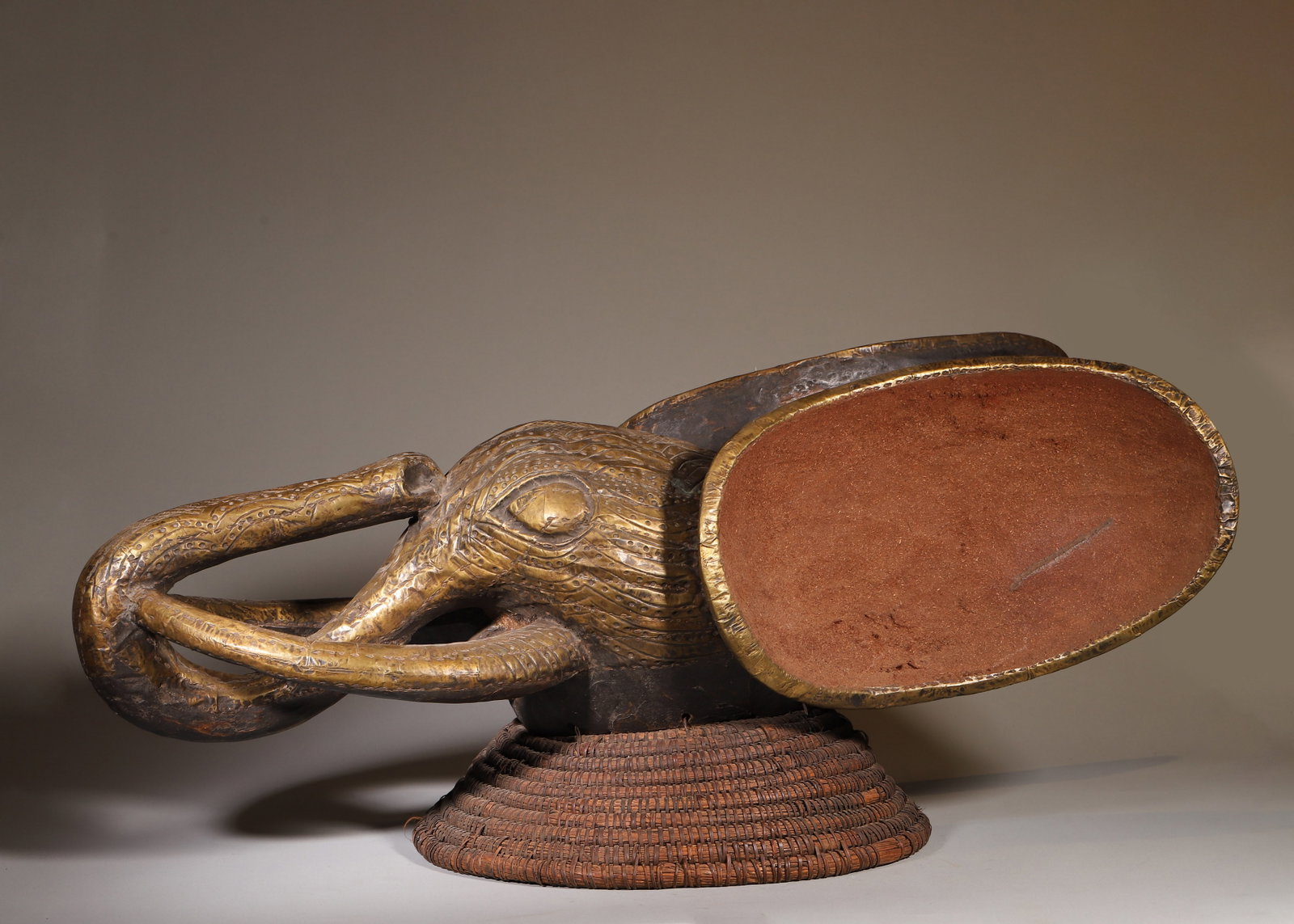 A SENUFO BRASS-CLAD WOOD ELEPHANT-CREST MASK (1 of 9)