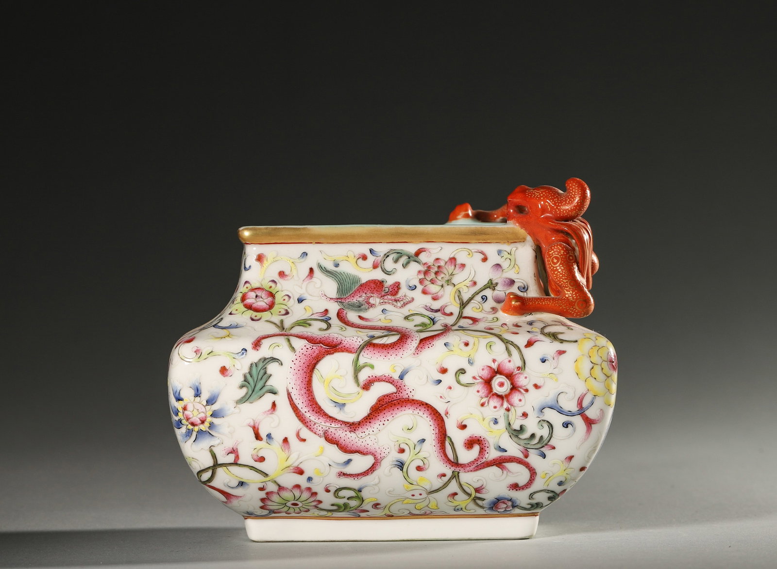 A FAMILLE-ROSE 'DRAGON' PORCELAIN WATER POT: A famille-rose porcelain water pot decorated with a dragon. L. 12.5 cm; W. 8.5 cm; Ht. 10.5 cm.