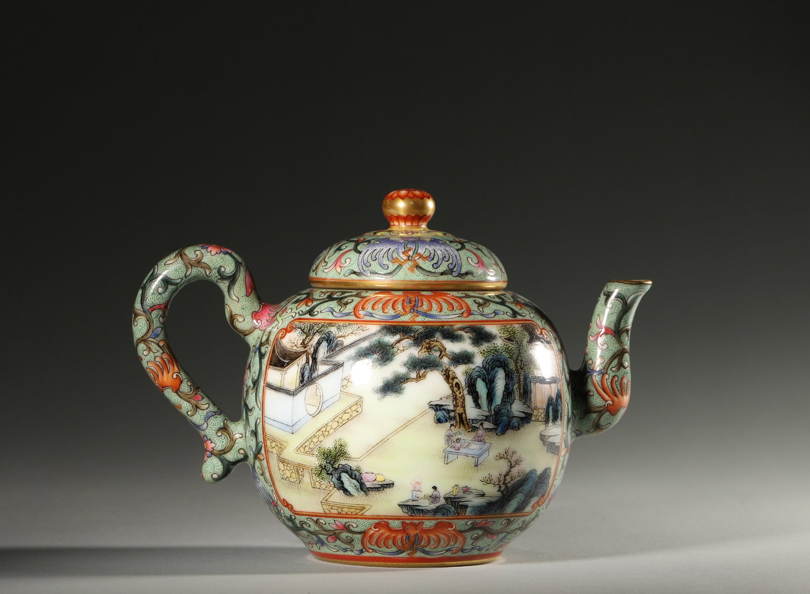 A POLYCHROME FIGURAL PORCELAIN TEAPOT: A polychrome porcelain teapot decorated with a figural scene. L. 20 cm; Ht. 13 cm.