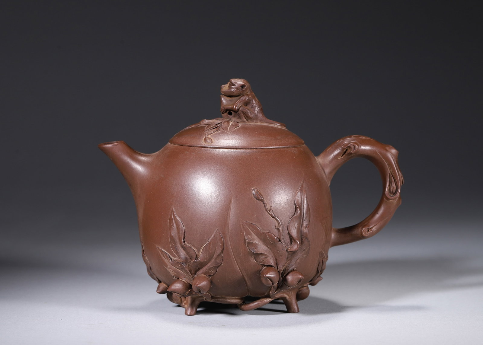 A ZISHA 'MONKEY AND PEACH' TEAPOT (1 of 10)