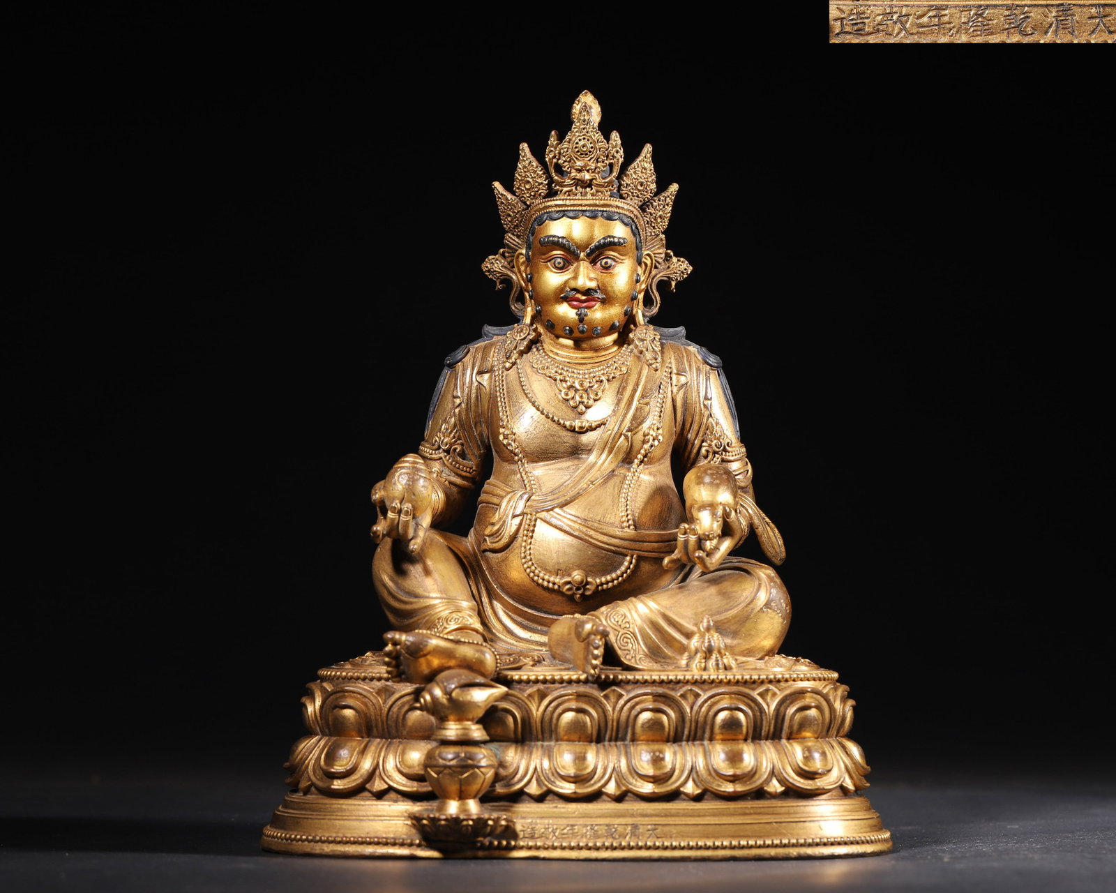 A GILT-BRONZE FIGURE OF YELLOW JAMBHALA (1 of 10)
