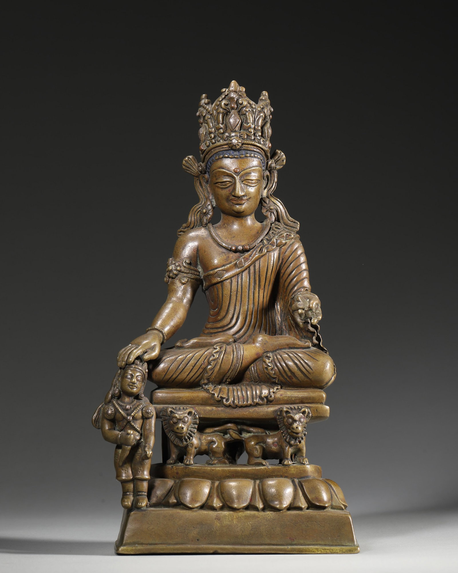 A BRONZE BODHISATTVA WITH ATTENDANT ON A LION THRONE (1 of 9)