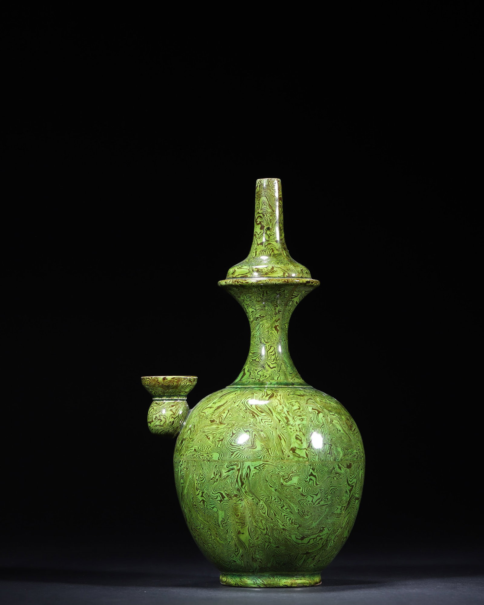 A GREEN-GLAZED MARBLED-CLAY (JIAOTAI) KUNDIKA (1 of 7)