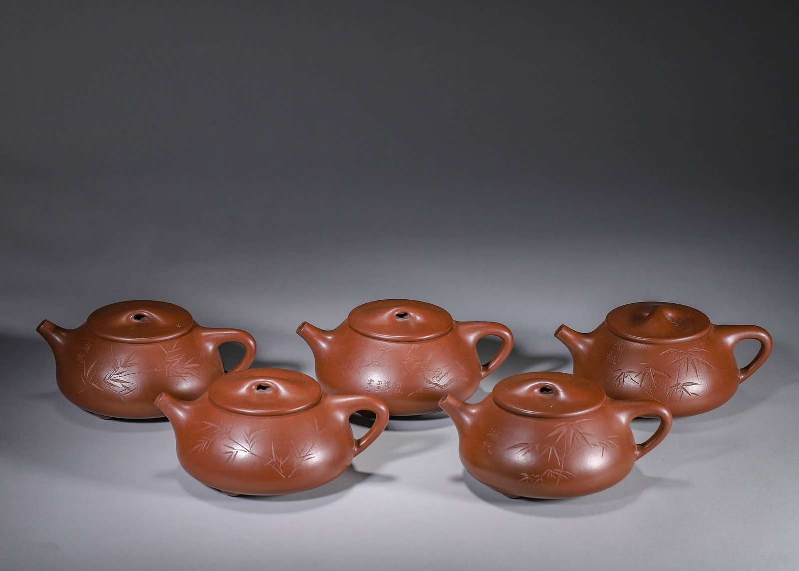 A SET OF FIVE ZISHA SHIPIAO TEAPOTS (1 of 16)