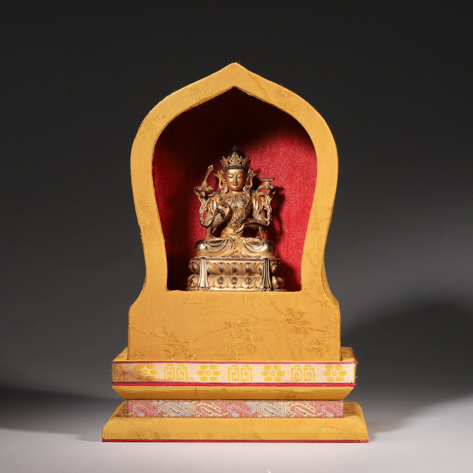 A GILT-BRONZE FIGURE OF MANJUSHRI WITH BROCADE NICHE (1 of 6)