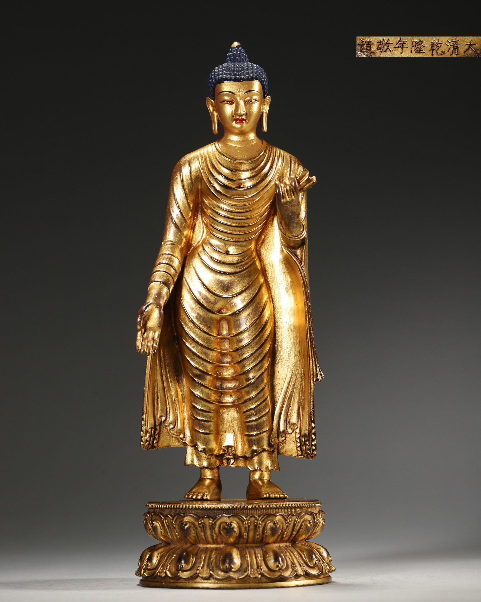 A GILT-BRONZE STANDING FIGURE OF SHAKYAMUNI BUDDHA (1 of 9)