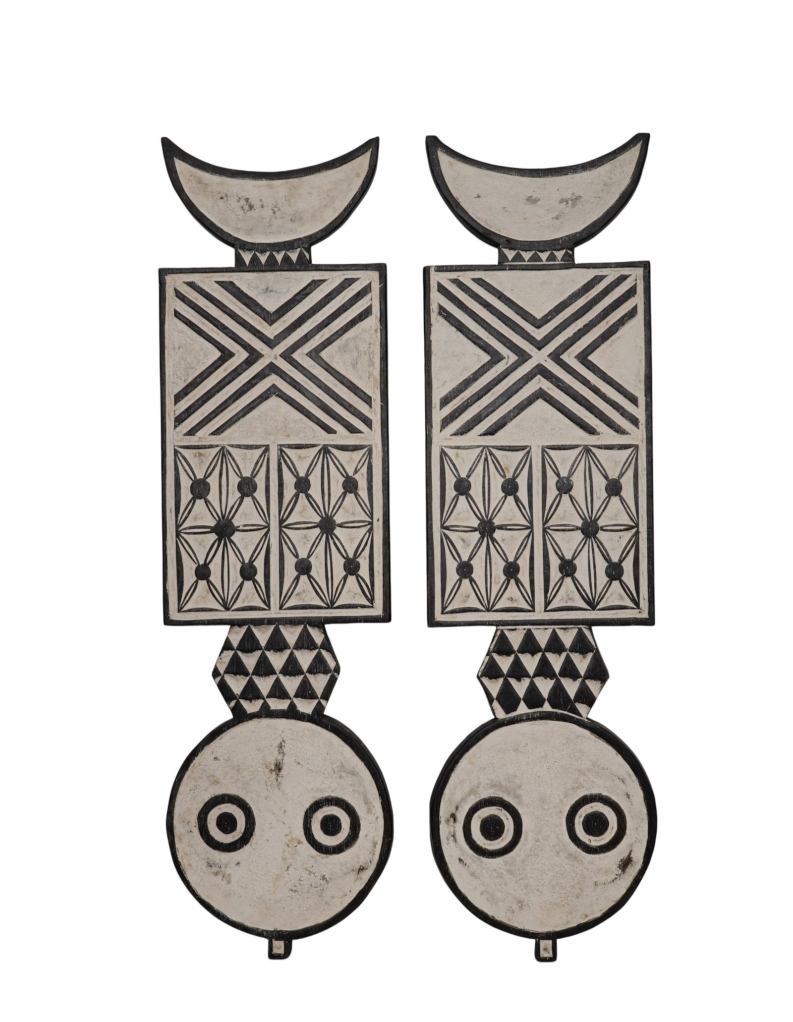 A PAIR OF BWA CARVED WOOD BIRD-FORM MASKS: A pair of Bwa carved wood bird-form masks decorated with black-and-white geometric patterns. Ht. 21 cm; W. 100 cm. Condition: Age-related wear and patina. Note: By repute, associated with Bwa ceremoni