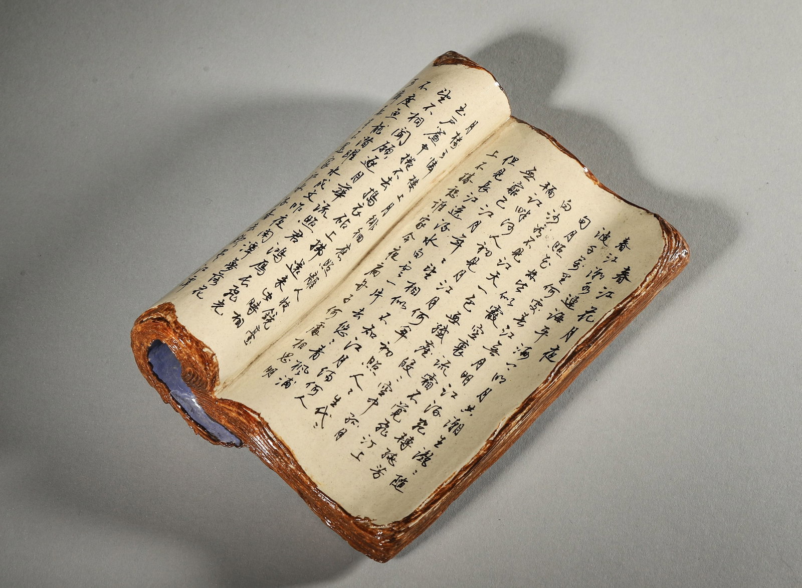 AN INSCRIBED BLUE-GLAZED PORCELAIN BOOK-FORM PAPERWEIGHT (1 of 9)