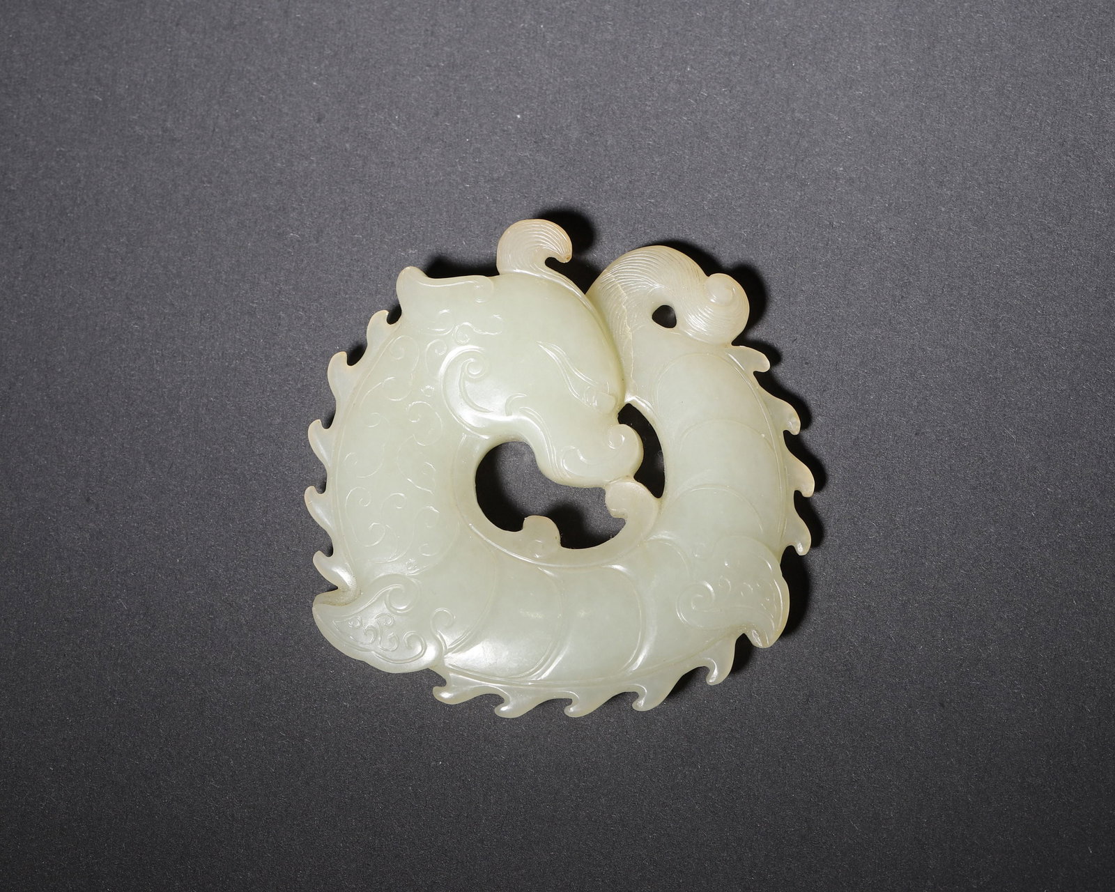 A WHITE JADE OPENWORK 'DRAGON' PENDANT (1 of 6)