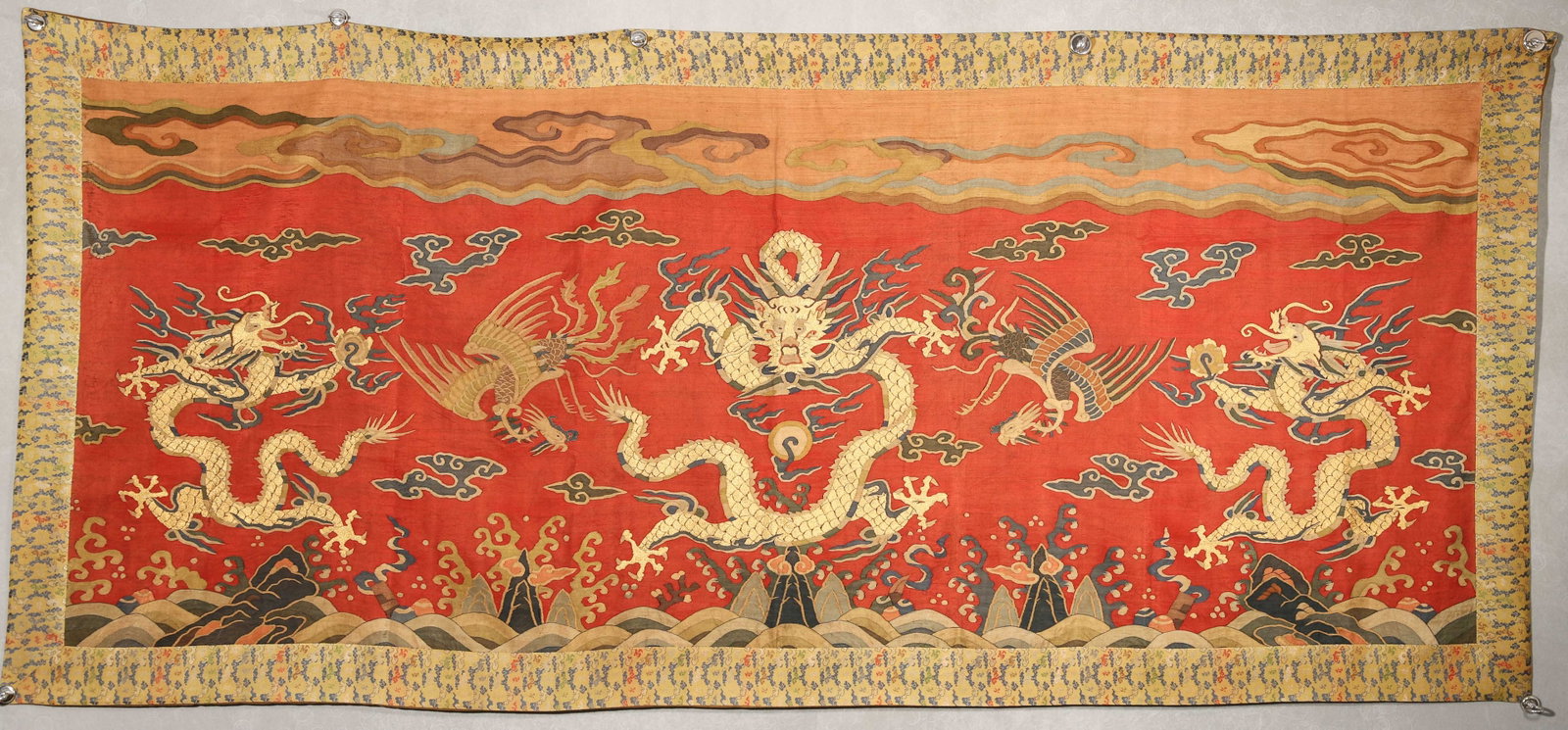 A KESI 'DRAGON AND PHOENIX' HANGING SCREEN: A kesi hanging screen woven with dragon and phoenix motifs. L. 211 cm; W. 94 cm.