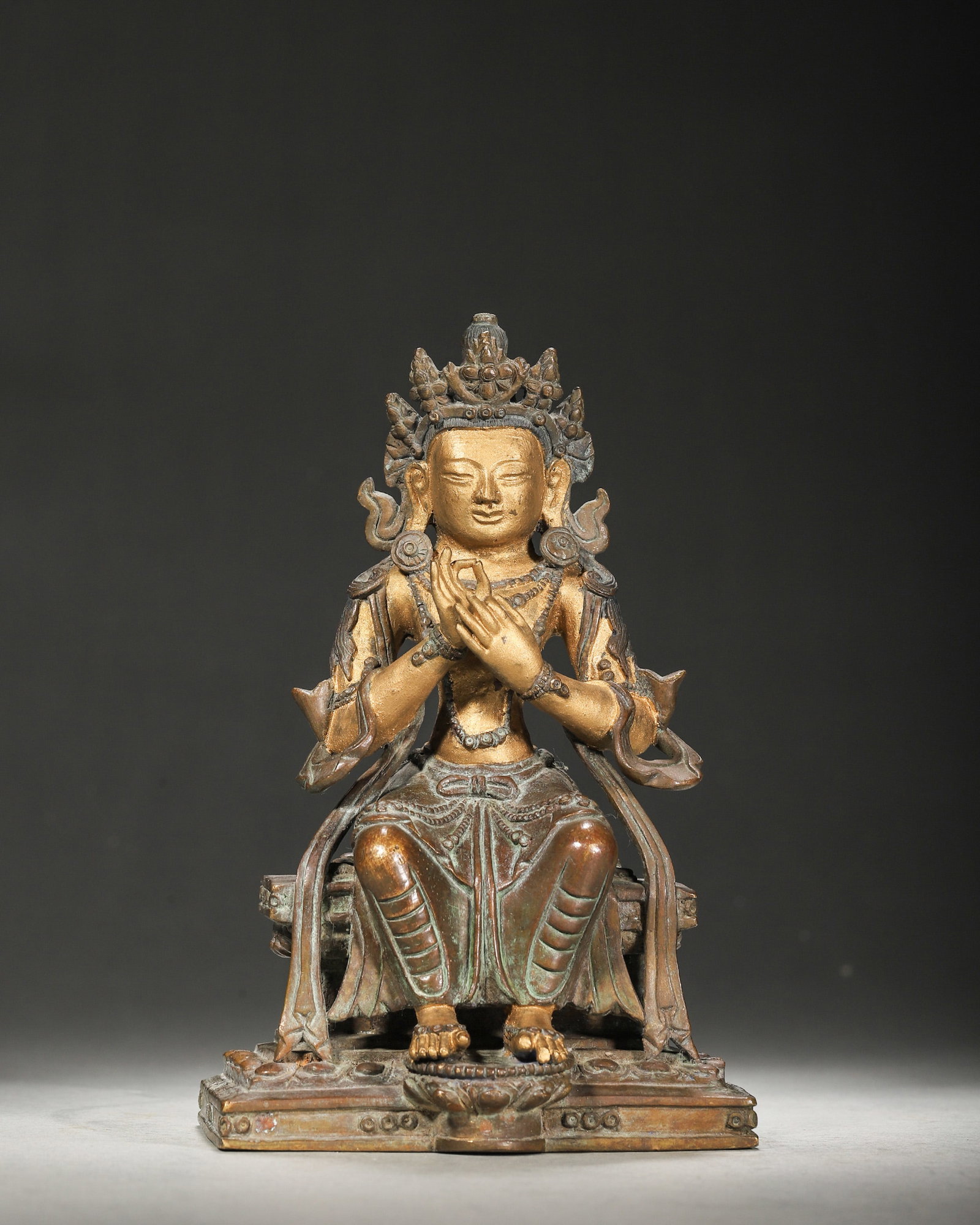 A GILT-BRONZE FIGURE OF GUANYIN: A gilt-bronze figure of Guanyin. L. 10 cm; Ht. 16.5 cm; Wt. 1,321 g.