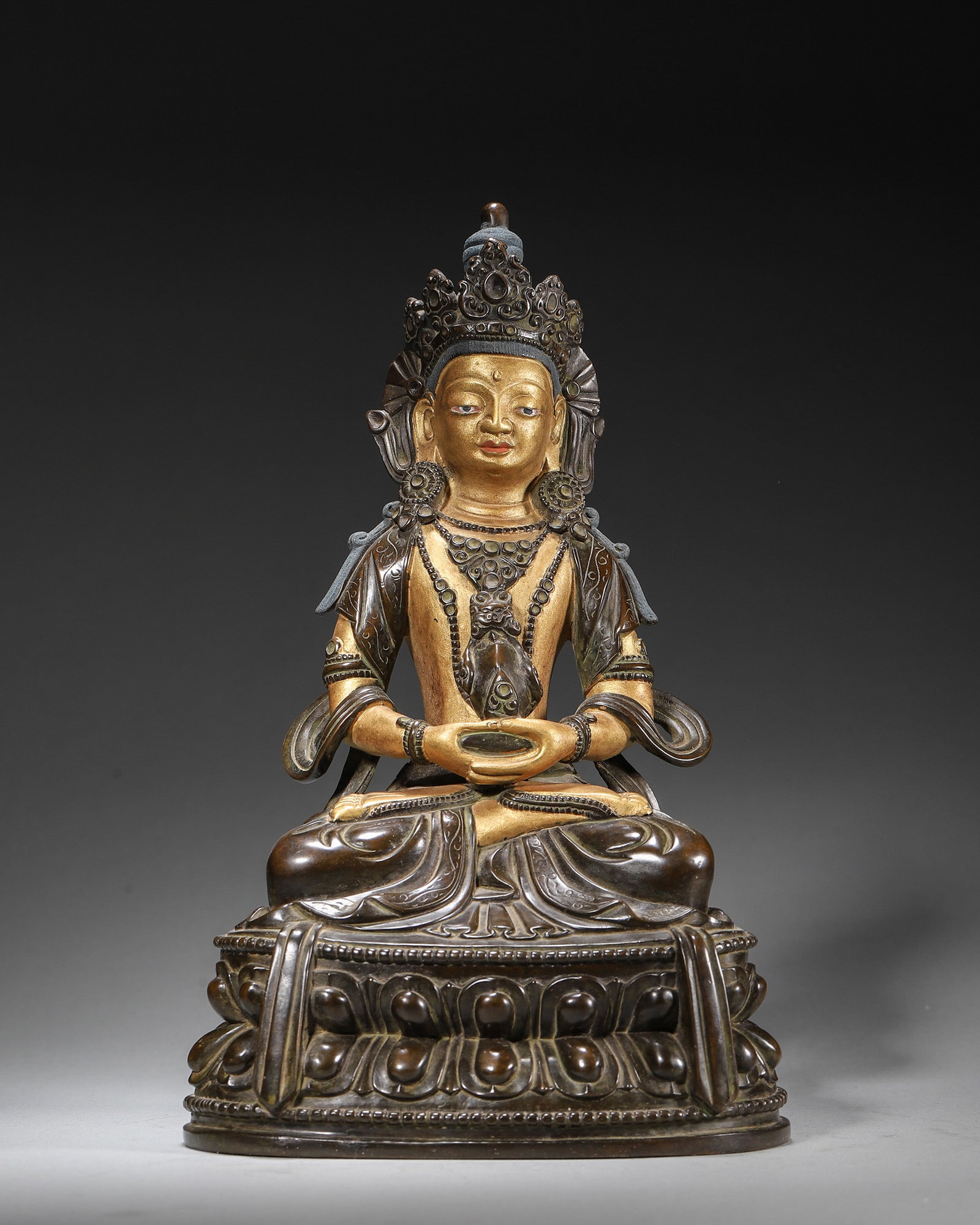 A GILT-BRONZE FIGURE OF VAJRASATTVA: A gilt-bronze figure of Vajrasattva. W. 14 cm; Ht. 22 cm; Wt. 1,879 g.