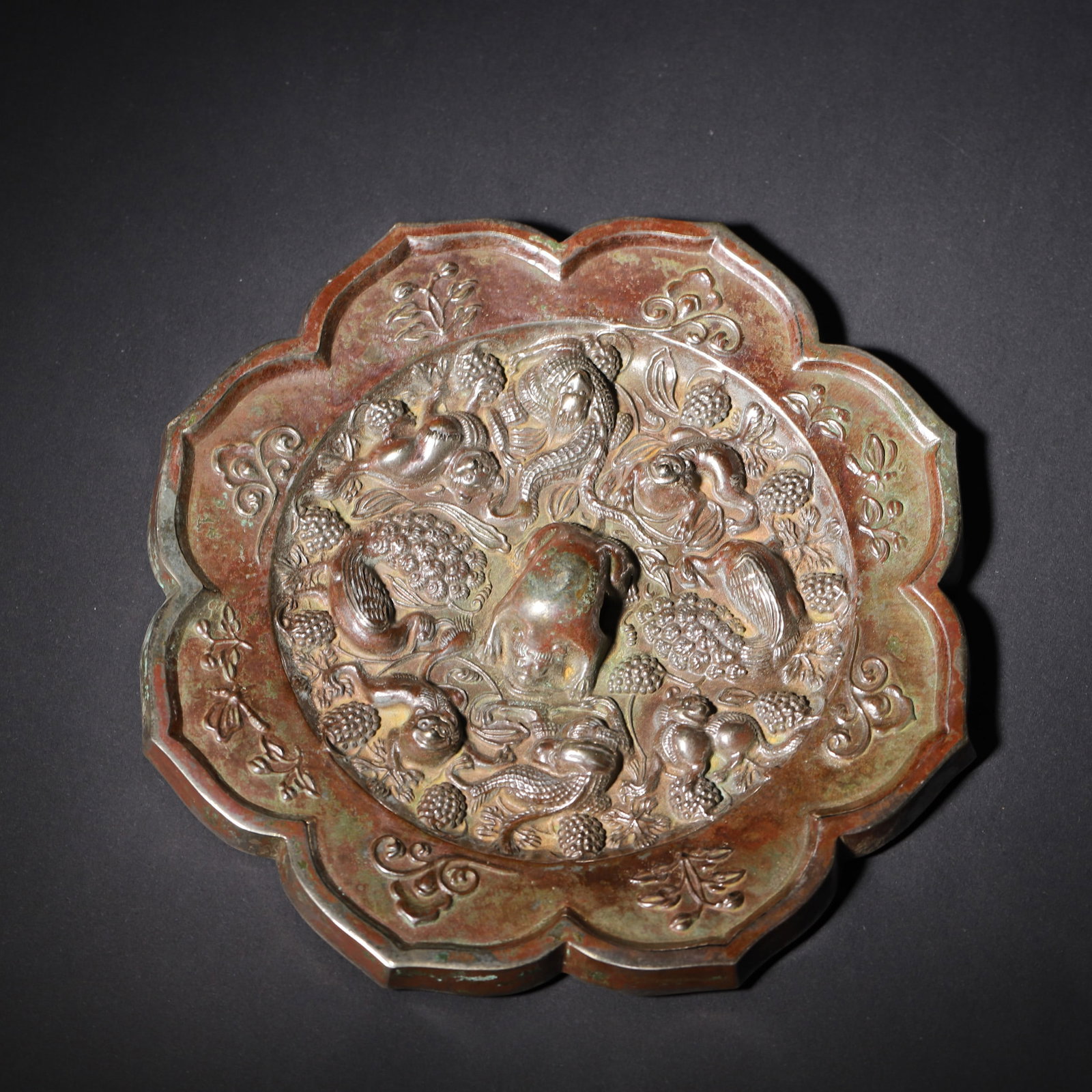 A BRONZE LOBED 'BEAST AND GRAPE' MIRROR (1 of 5)
