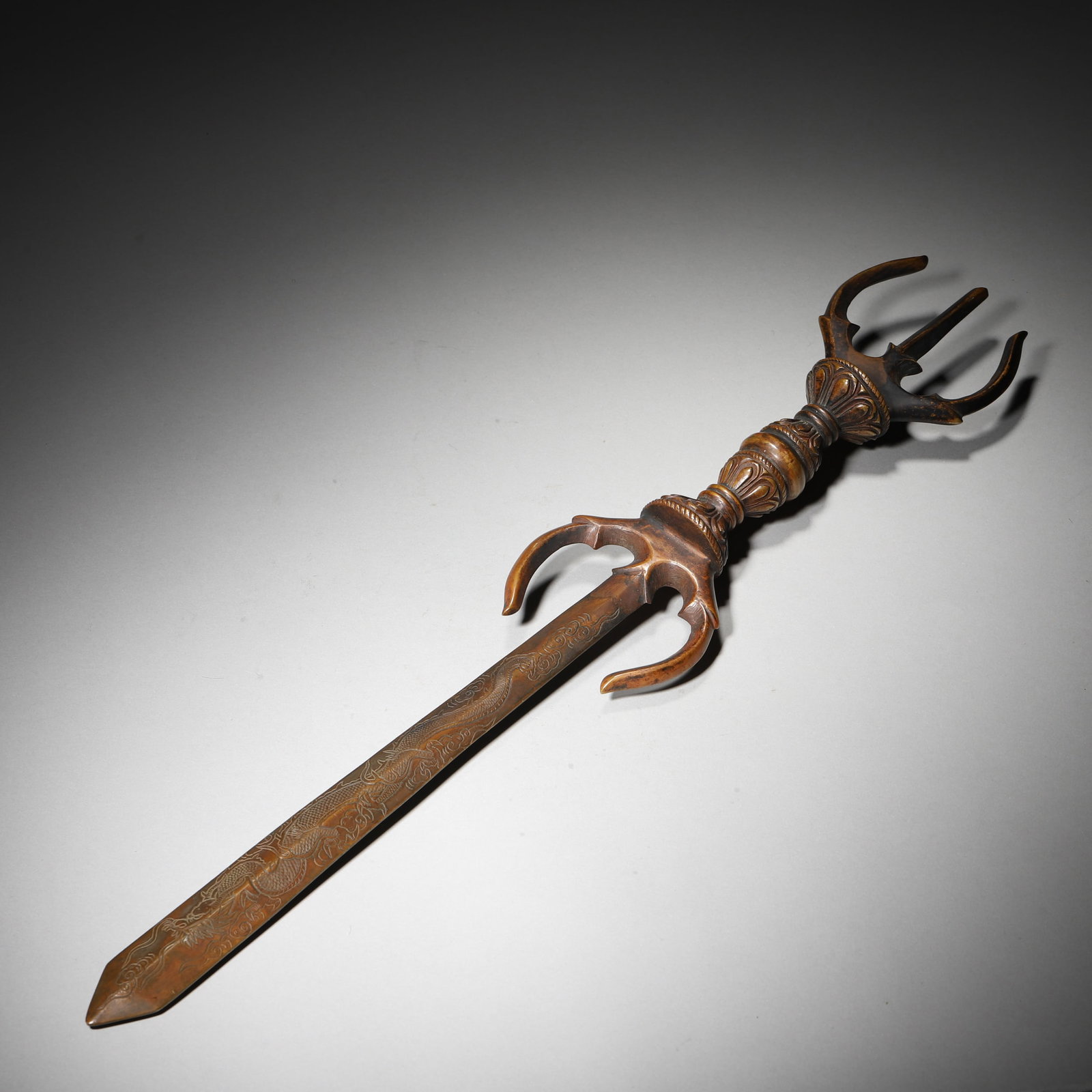 A BRONZE TRIDENT-FORM RITUAL IMPLEMENT WITH DRAGON DECORATION (1 of 4)