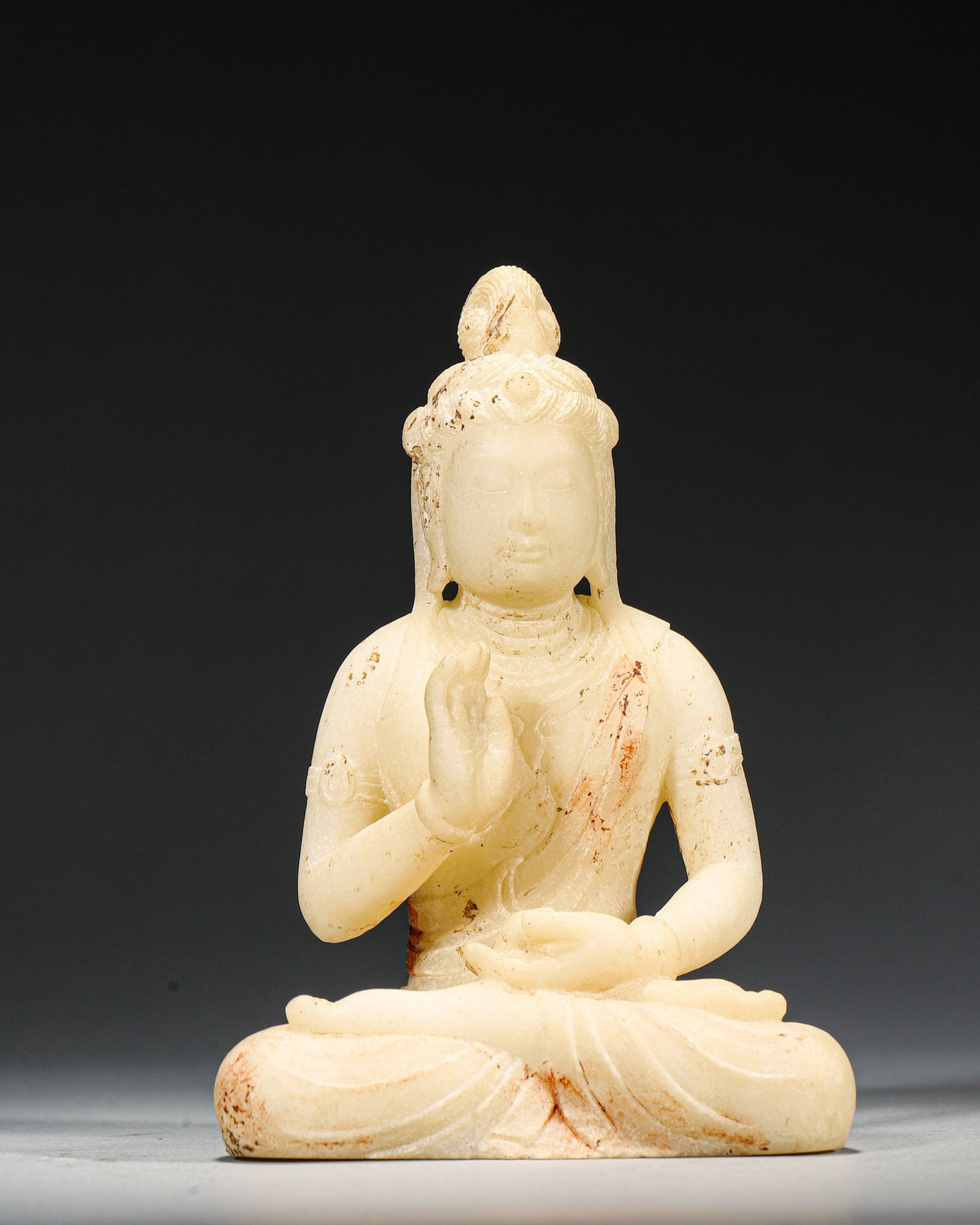 A WHITE JADE SEATED FIGURE OF GUANYIN (1 of 7)