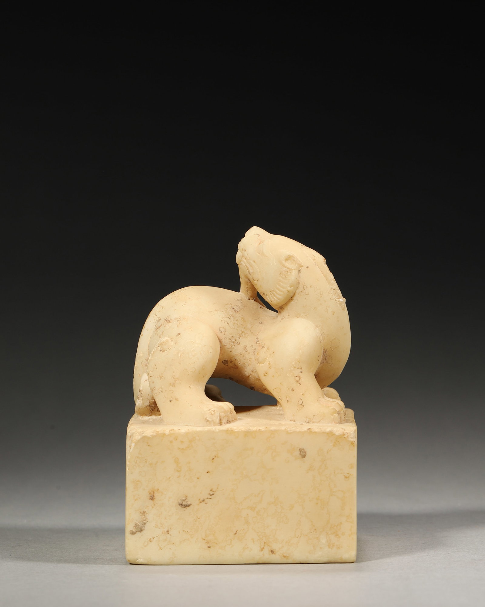 A WHITE JADE BEAST-FORM ORNAMENT (1 of 6)