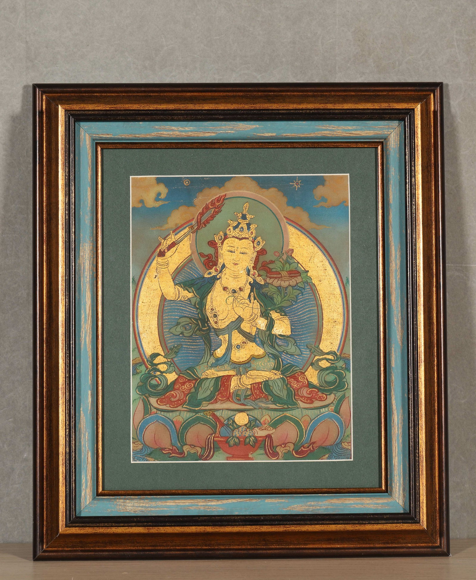 A FRAMED THANGKA OF MANJUSHRI (1 of 4)