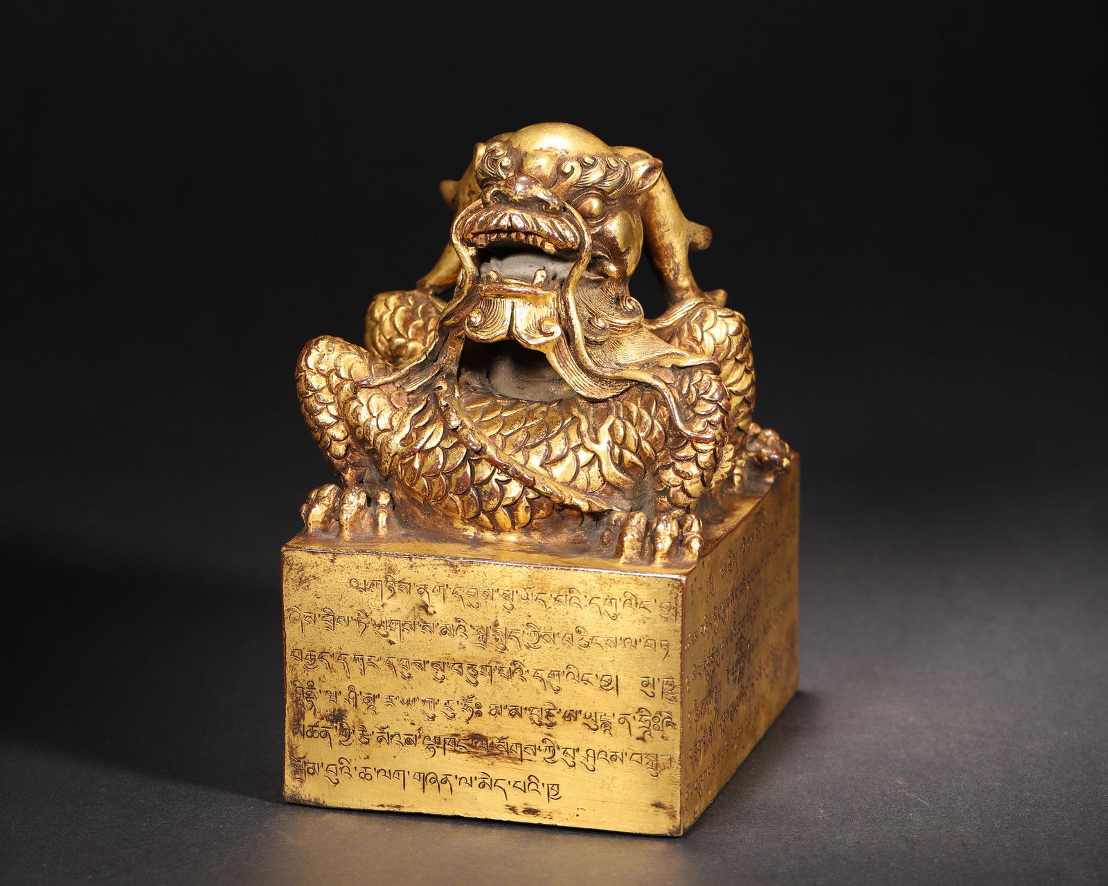 A GILT-BRONZE COILED-DRAGON-KNOB SEAL WITH FOUR-SCRIPT INSCRIPTION (1 of 10)