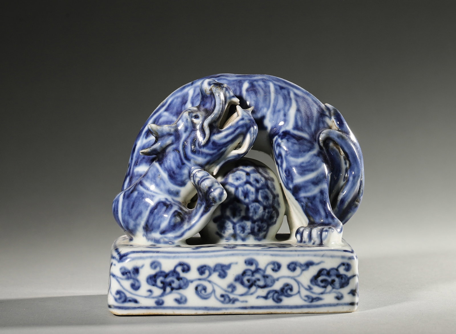 A BLUE-AND-WHITE BEAST-FORM PORCELAIN PAPERWEIGHT (1 of 6)