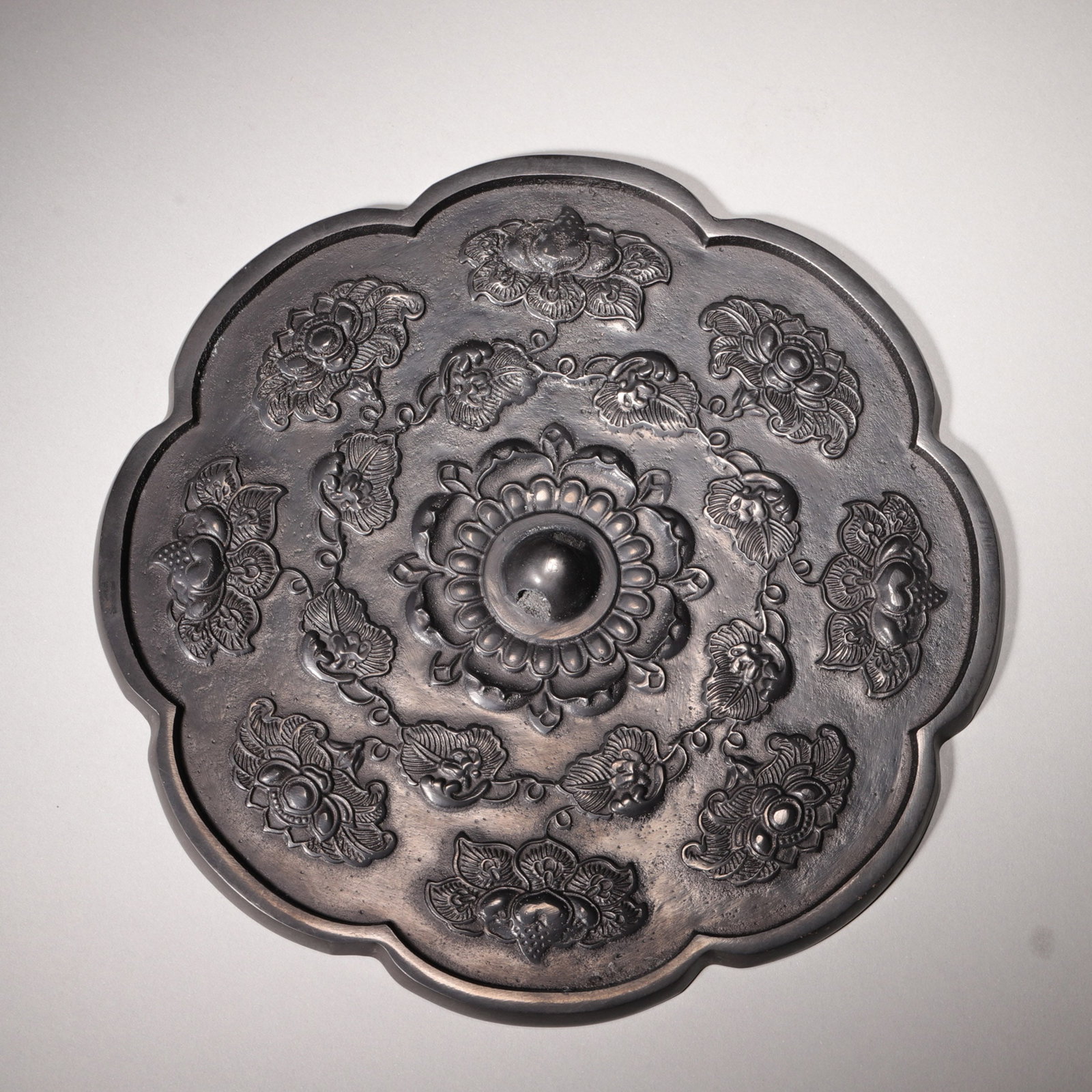 A LOBED BRONZE 'BAT AND FLORAL' MIRROR (1 of 5)