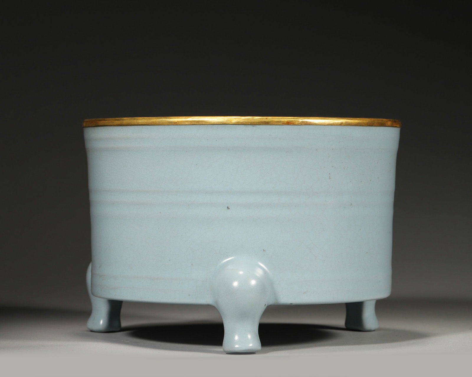 A RU-TYPE SKY-BLUE-GLAZED TRIPOD CENSER WITH GILT-METAL RIM (1 of 7)