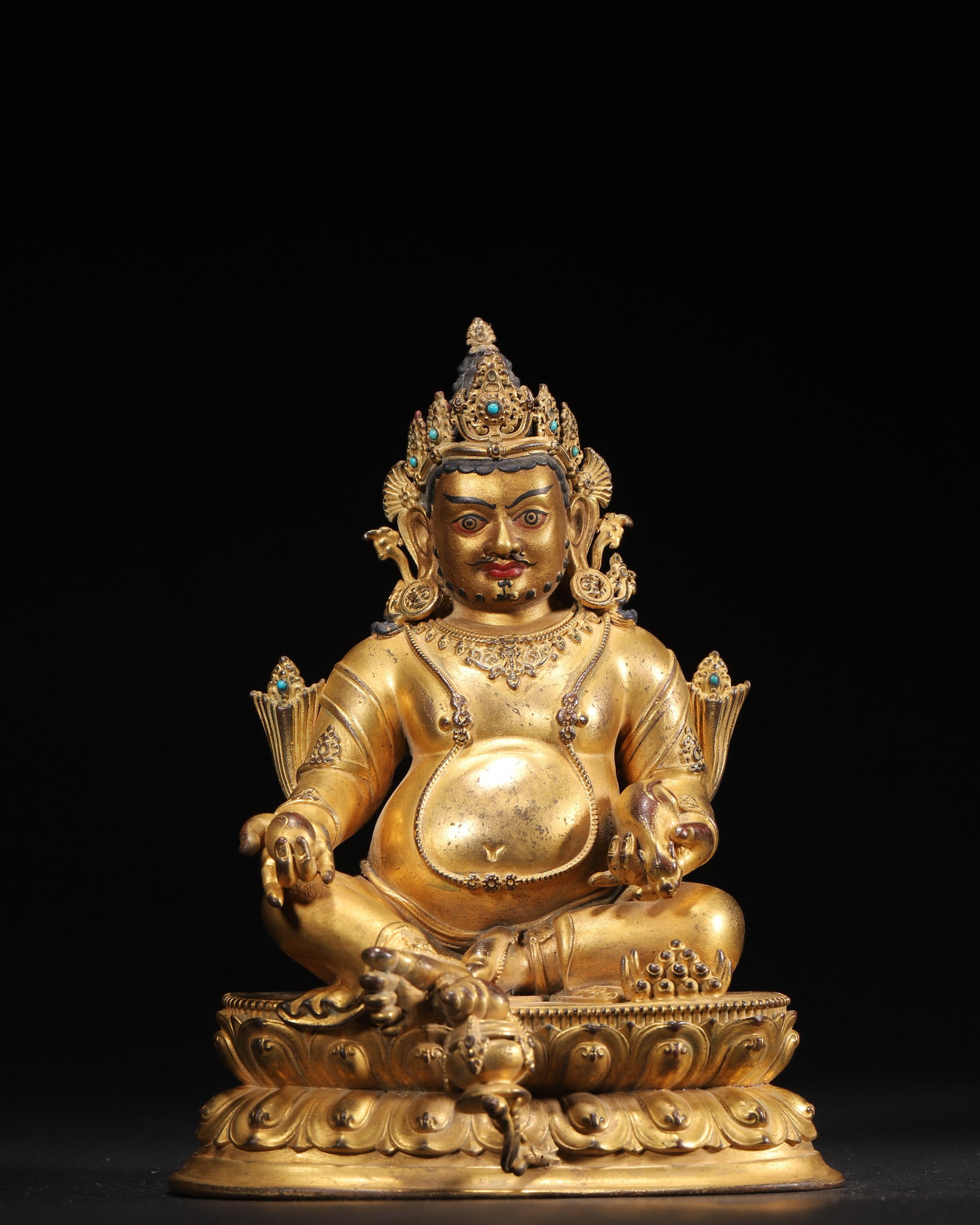 A GILT-BRONZE FIGURE OF YELLOW JAMBHALA WITH COLORED-STONE INLAY (1 of 11)